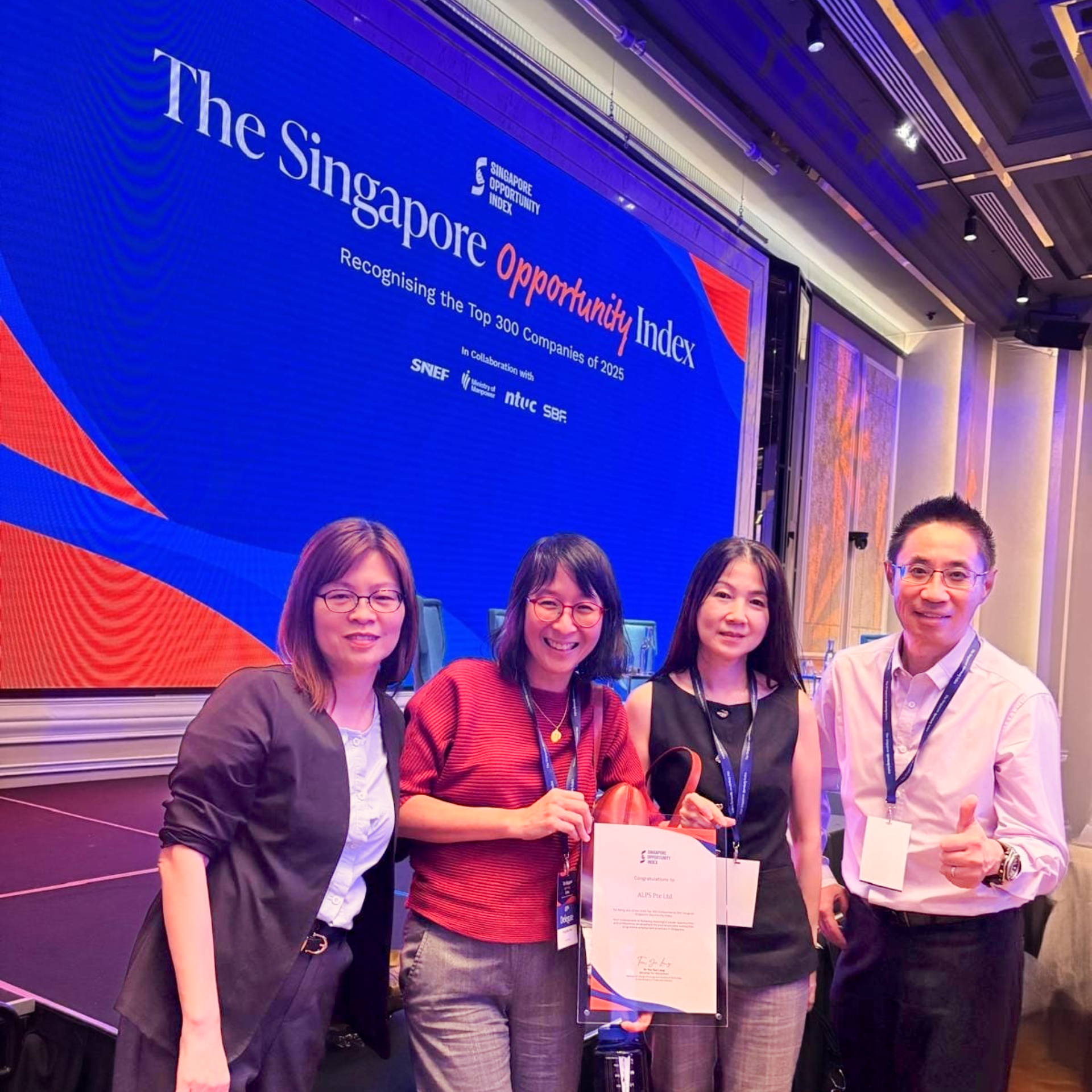 Photo of ALPS CEO, CHRO and 2 other HR representatives with the Singapore Opportunity Index Award Certificate