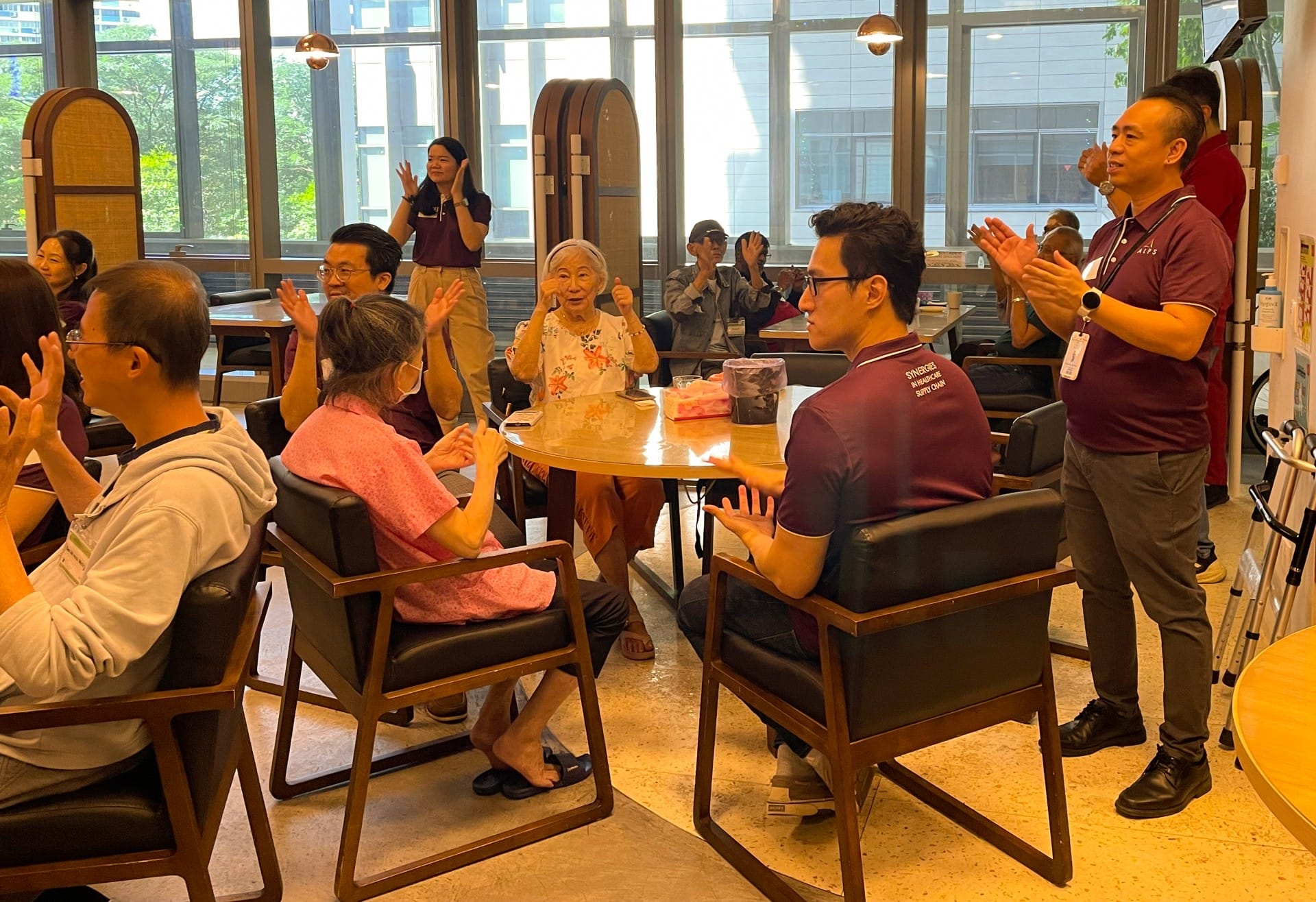 Image of ALPS Staff interacting with the patients at HCA Hospice Oasis@Outram