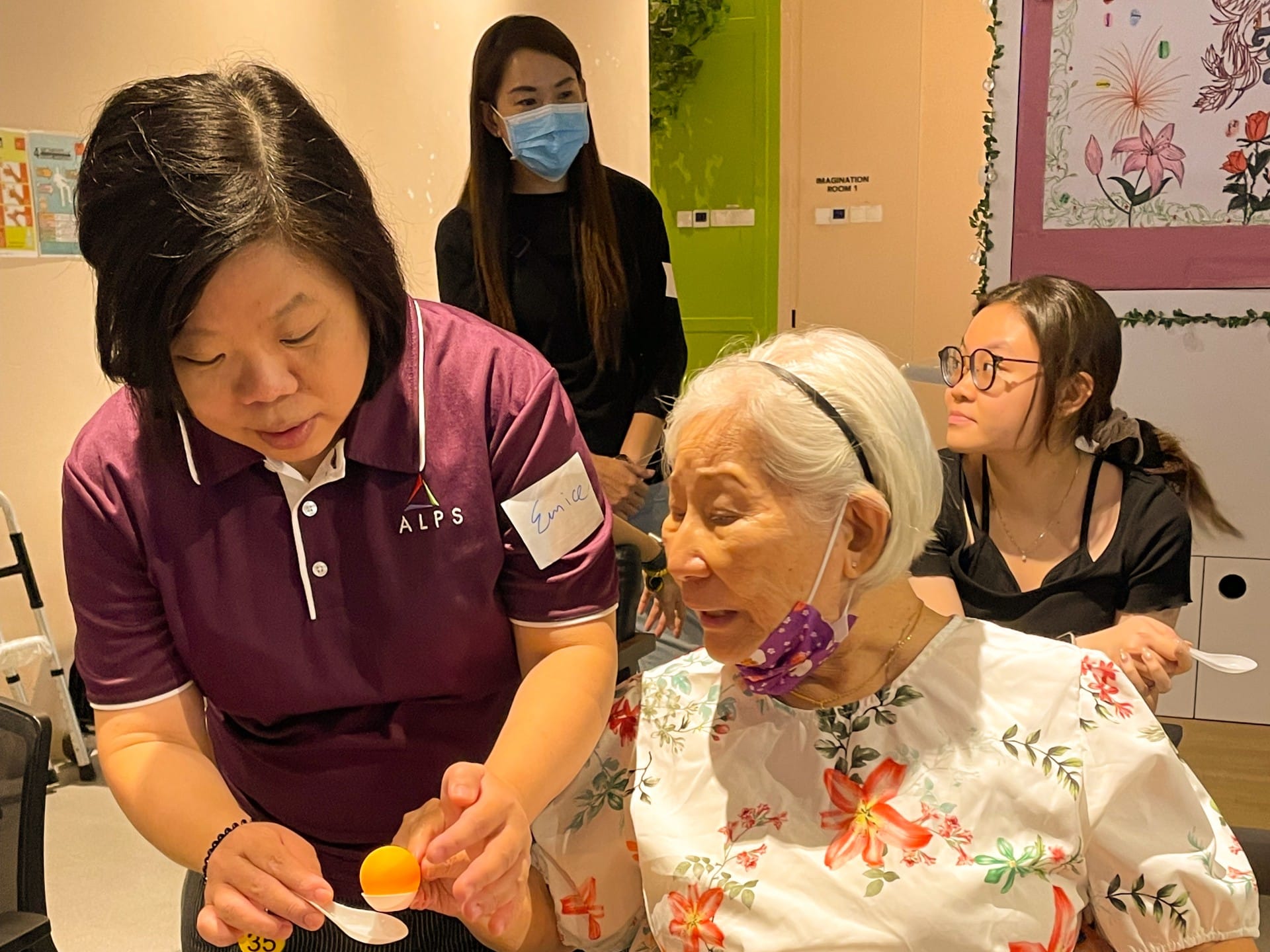Image of ALPS Staff interacting with the patients at HCA Hospice Oasis@Outram