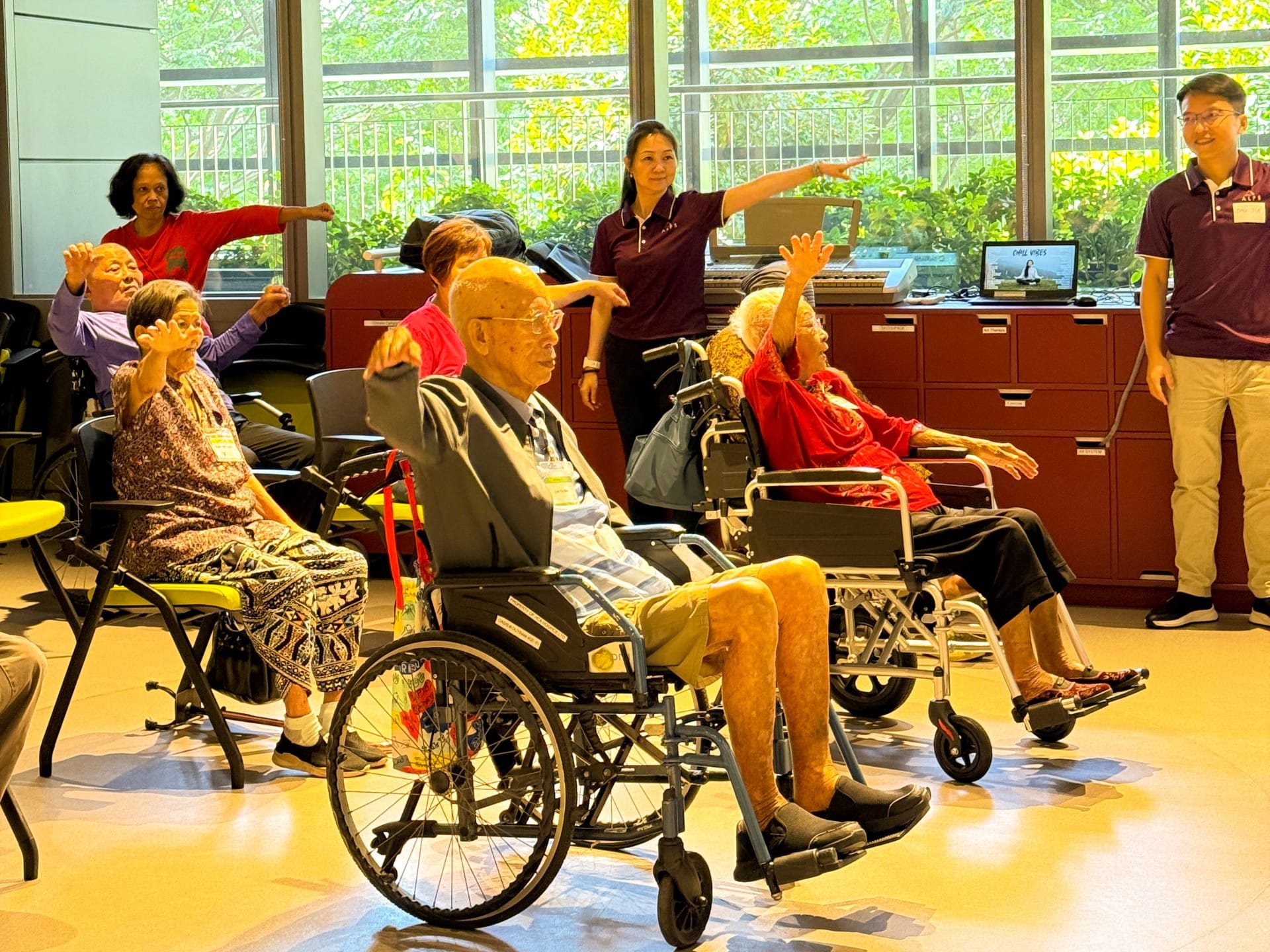 Image of ALPS Staff interacting with the patients at HCA Hospice Oasis@Outram