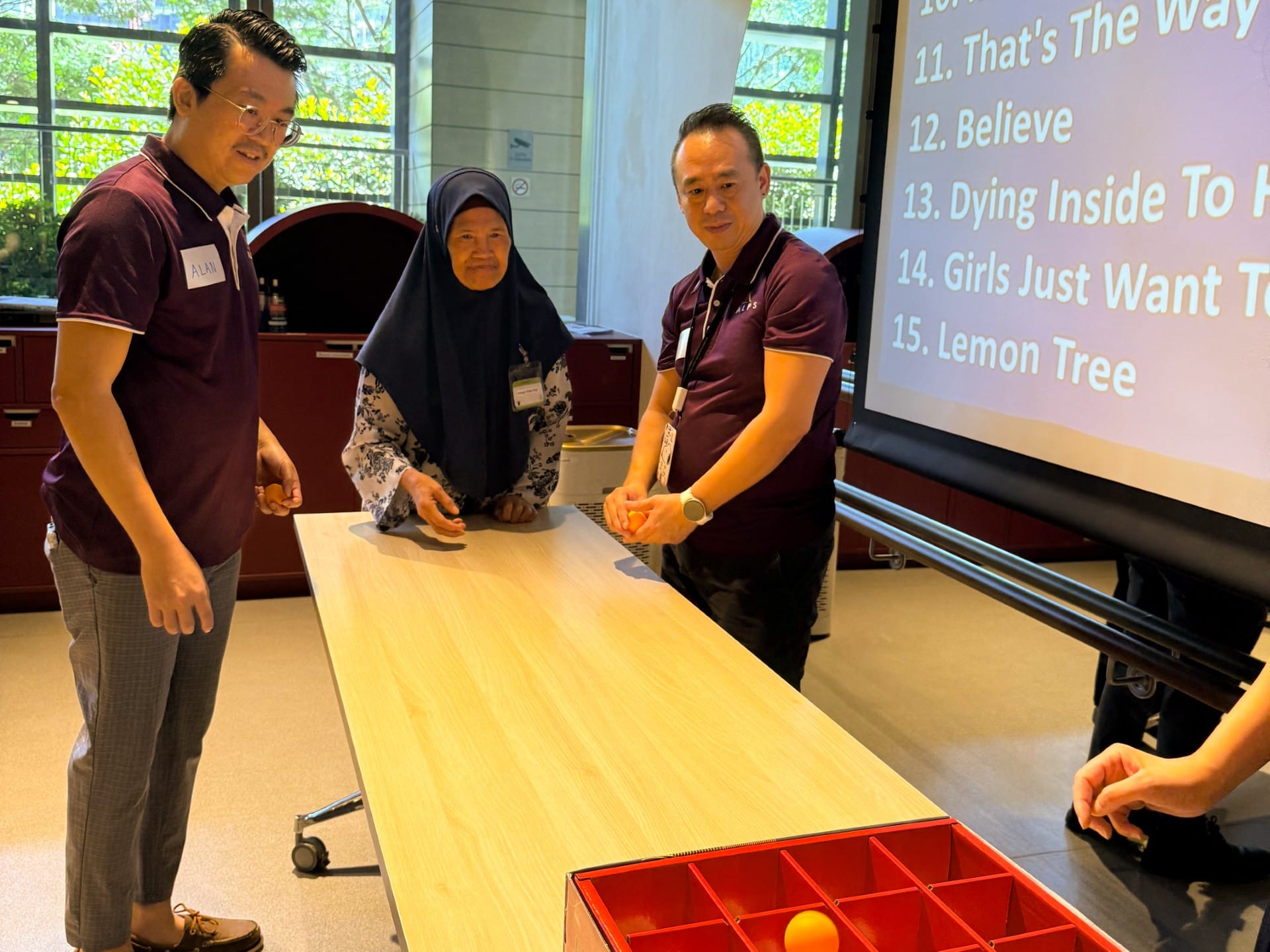Image of ALPS Staff interacting with the patients at HCA Hospice Oasis@Outram