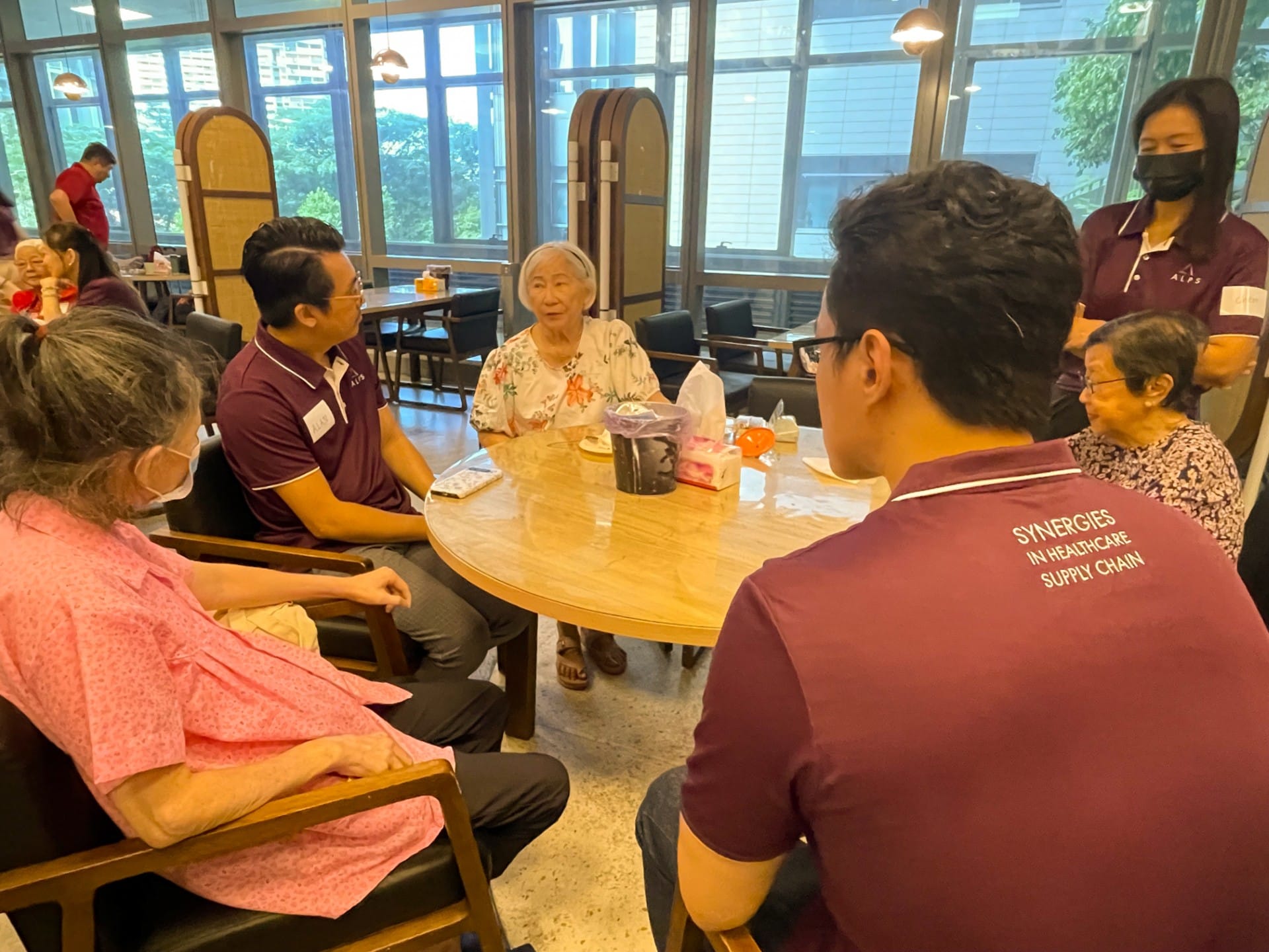Image of ALPS Staff interacting with the patients at HCA Hospice Oasis@Outram
