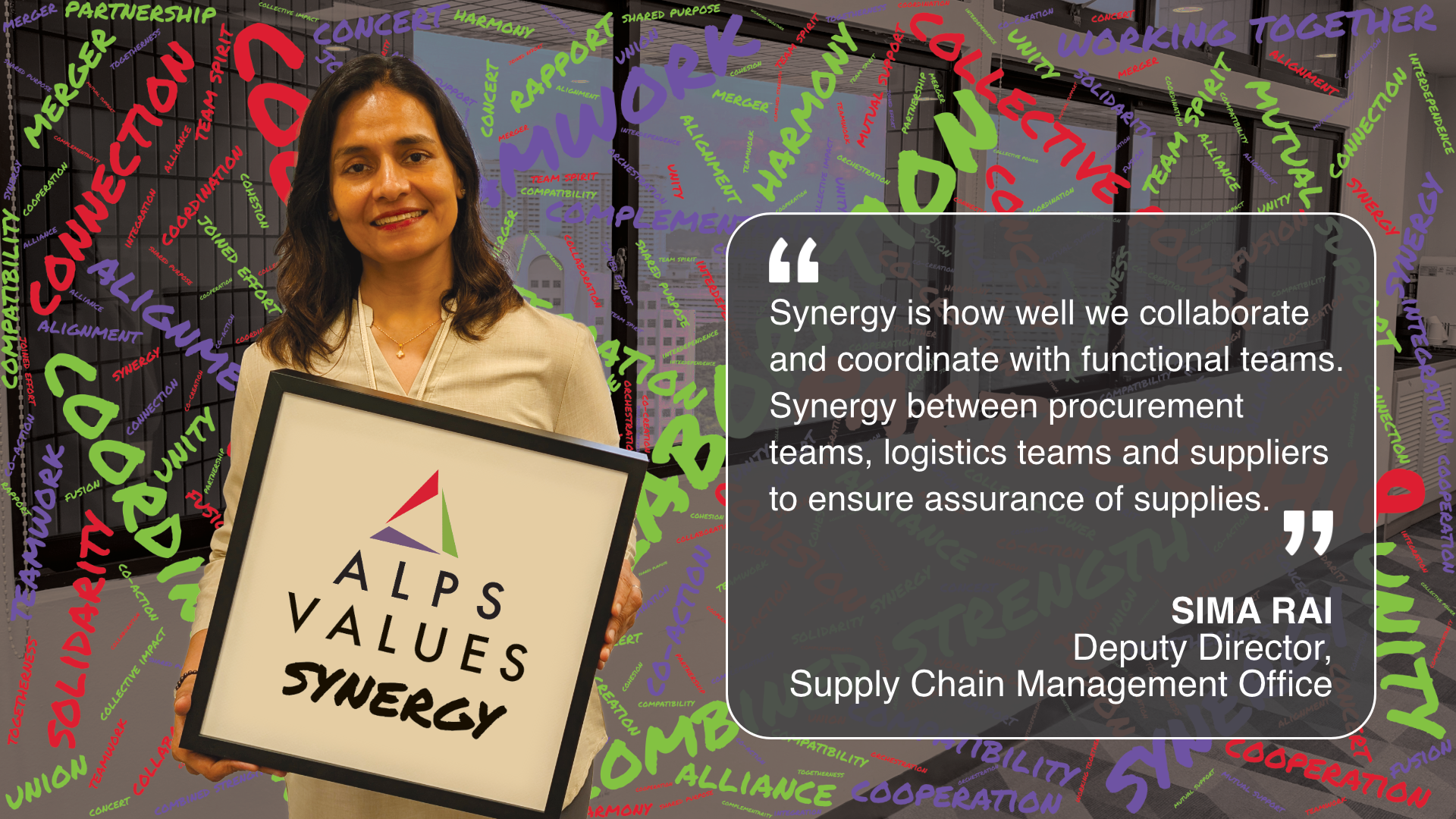 Image of ALPS colleague holding card displaying words 'ALPS Values Synergy'