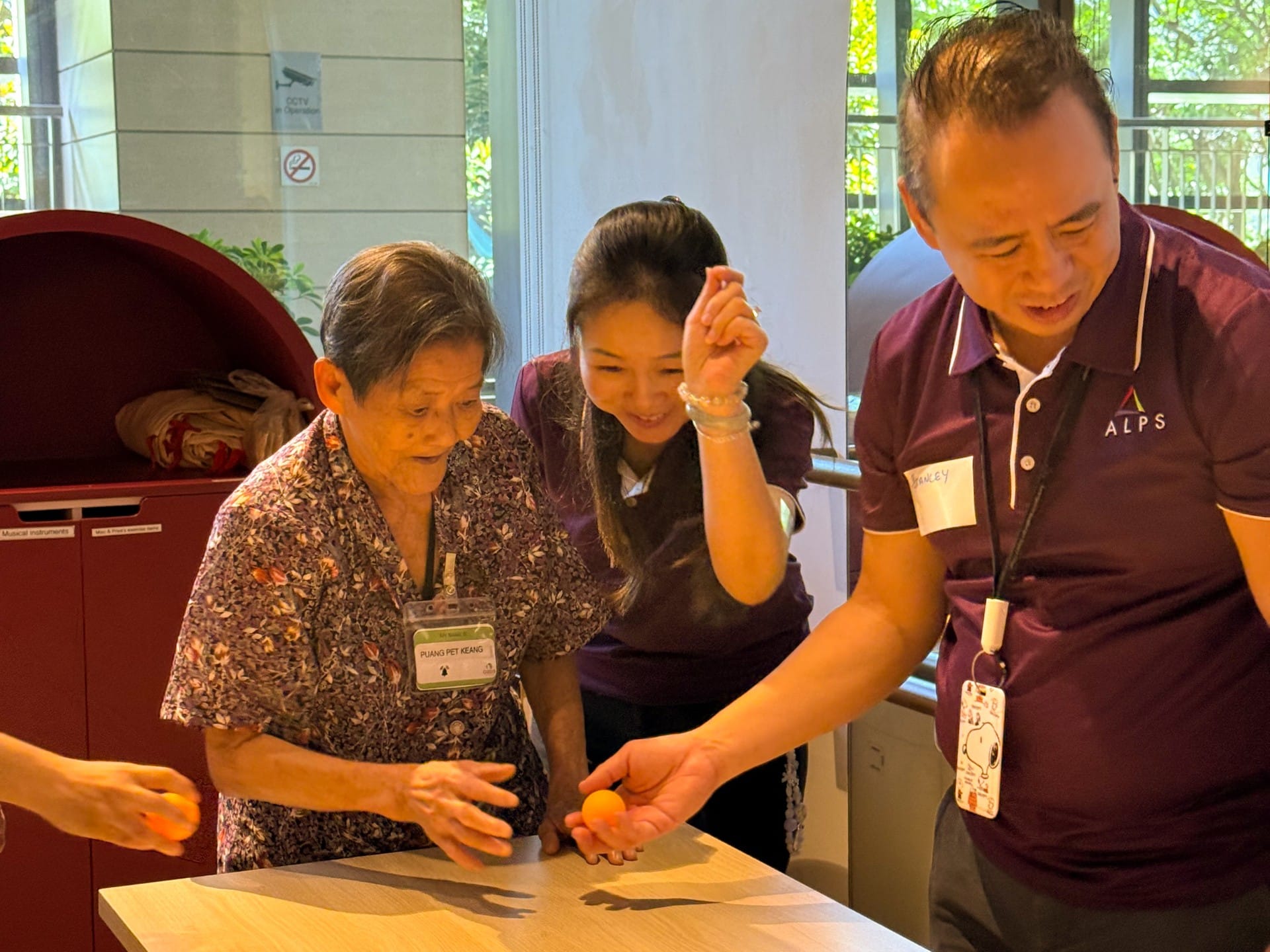 Image of ALPS Staff interacting with the patients at HCA Hospice Oasis@Outram
