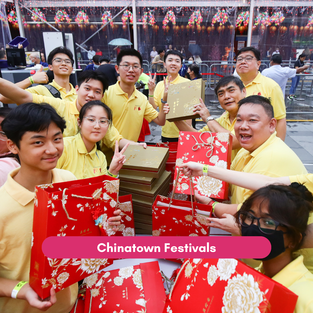 Youth volunteers prepare festive gift bags for Chinatown festival activities.