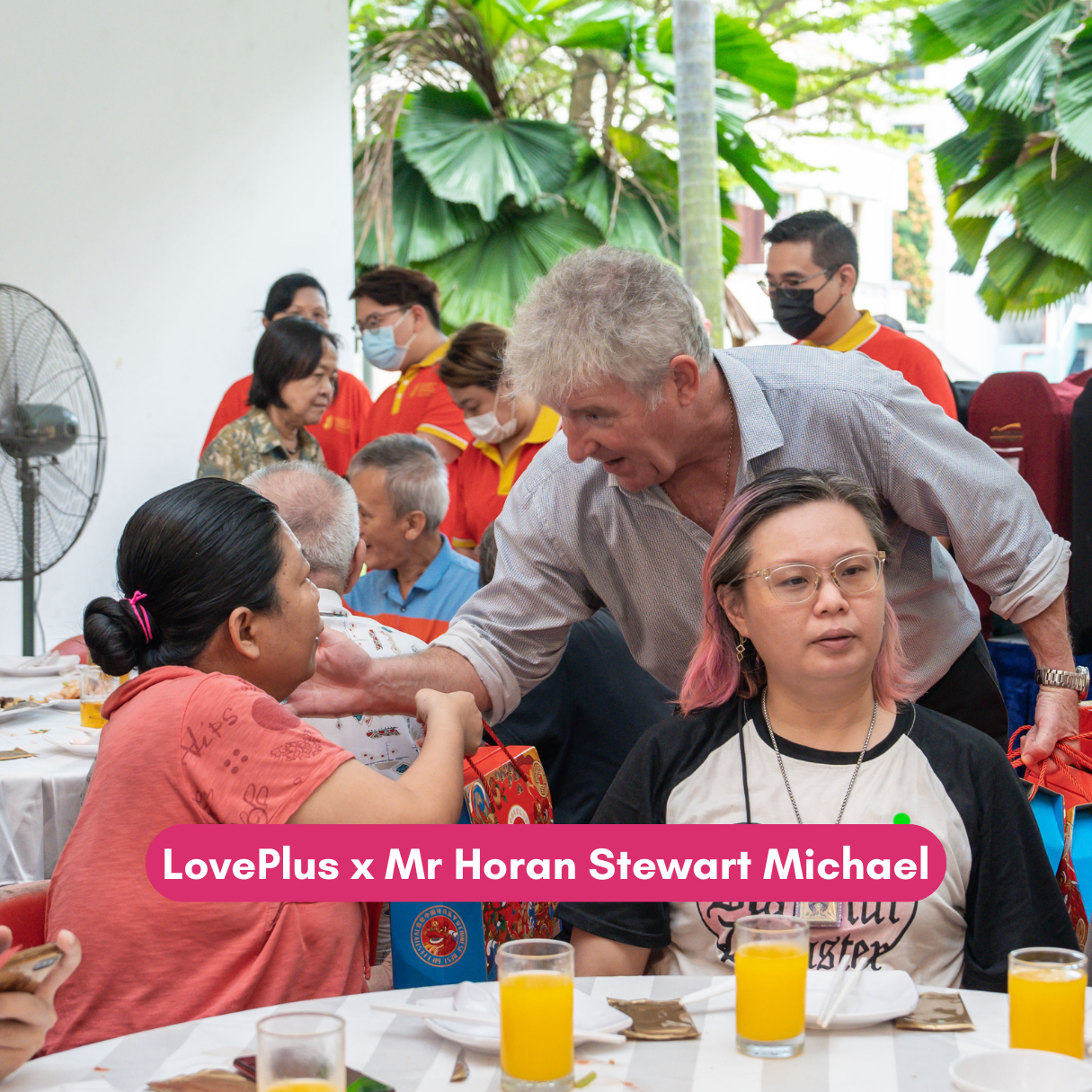 Guest interacts with residents during a LovePlus community gathering.