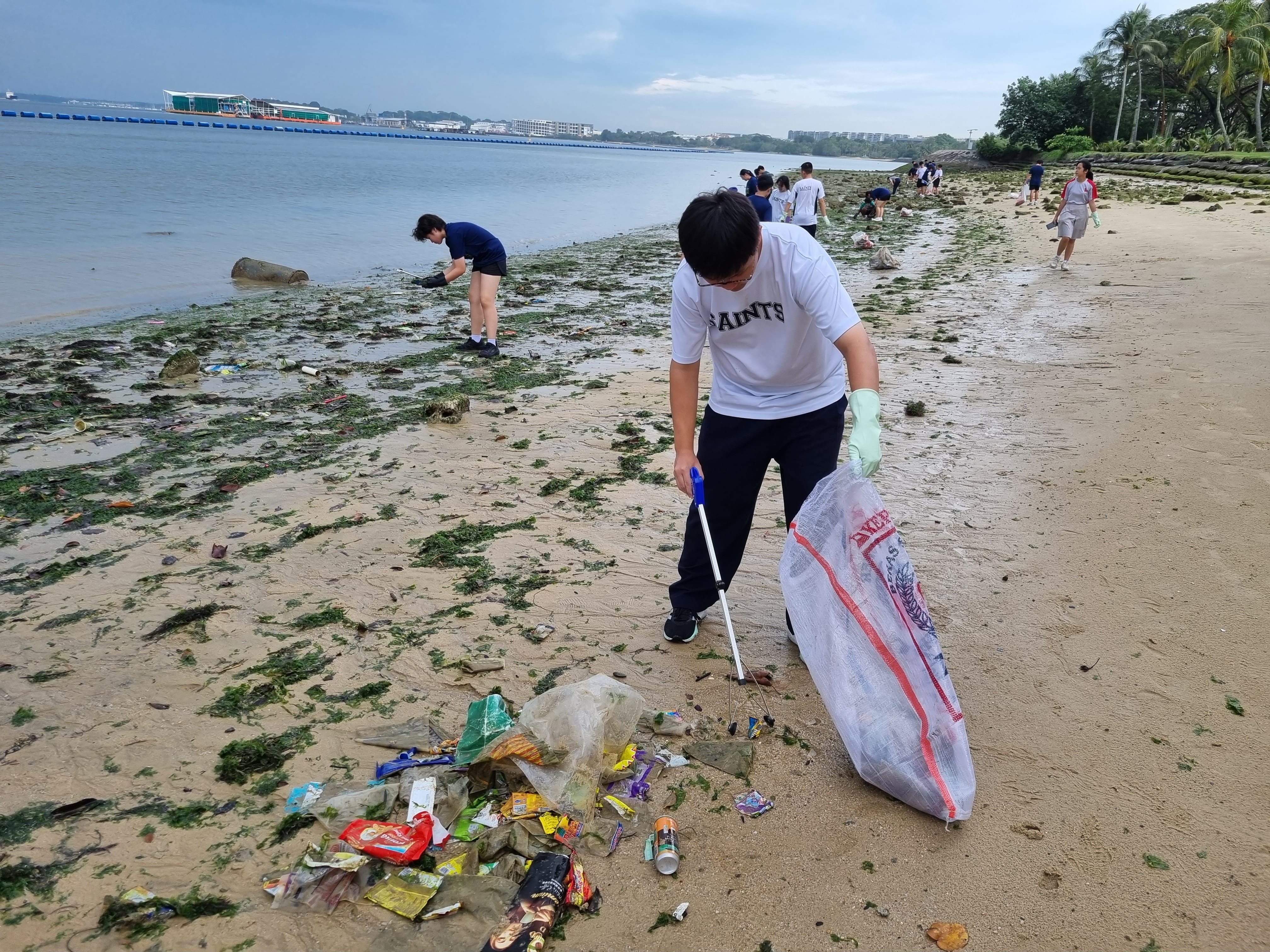 Litter picking at Pasir Ris Beach in collaboration with National Junior College