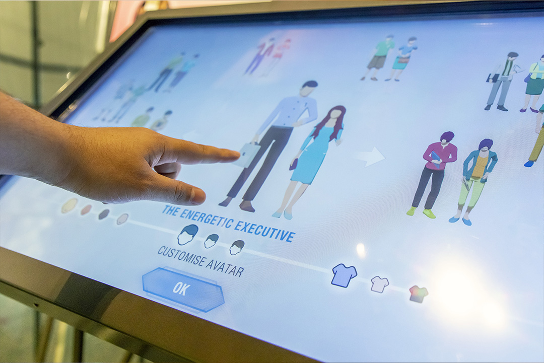 Photo of a person choosing their persona at the exhibition.