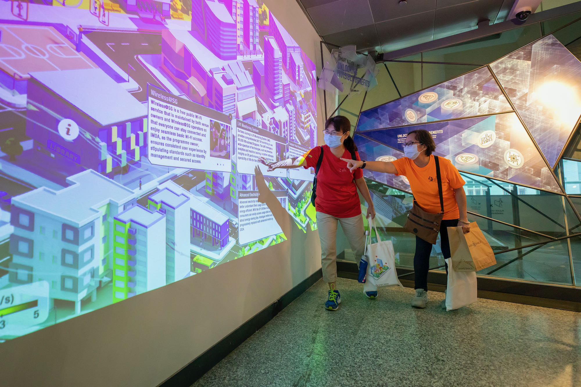 Photo of visitors exploring information about various technologies at the CityScape exhibition.