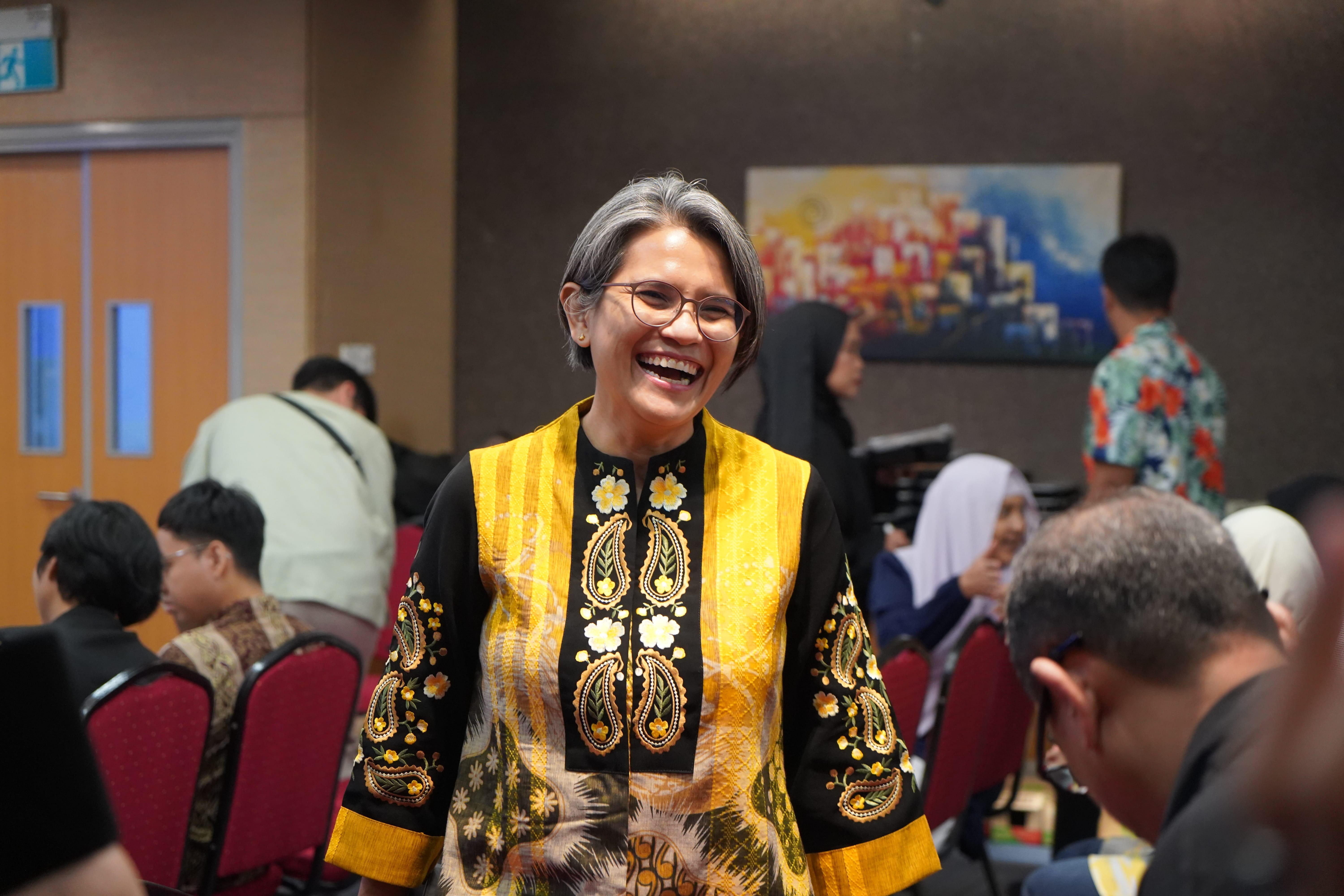 President of LKM shares a laugh with members post-AGM.