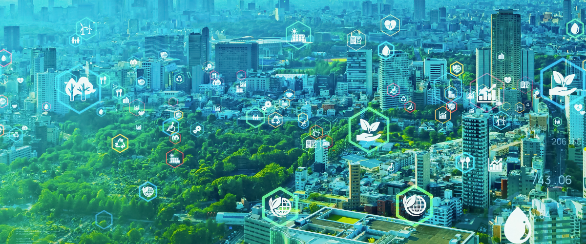 Modern city skyline overlaid with green technology and sustainability icons, symbolising smart urban development and environmental innovation.