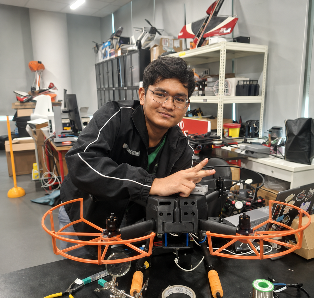 Shafriel Nur Iman, Team RP’s Unmanned Aerial Systems competitor, posing with a drone during a training session.