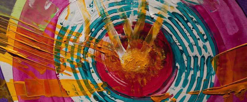 Swirl of different coloured acrylic paint layered into each other