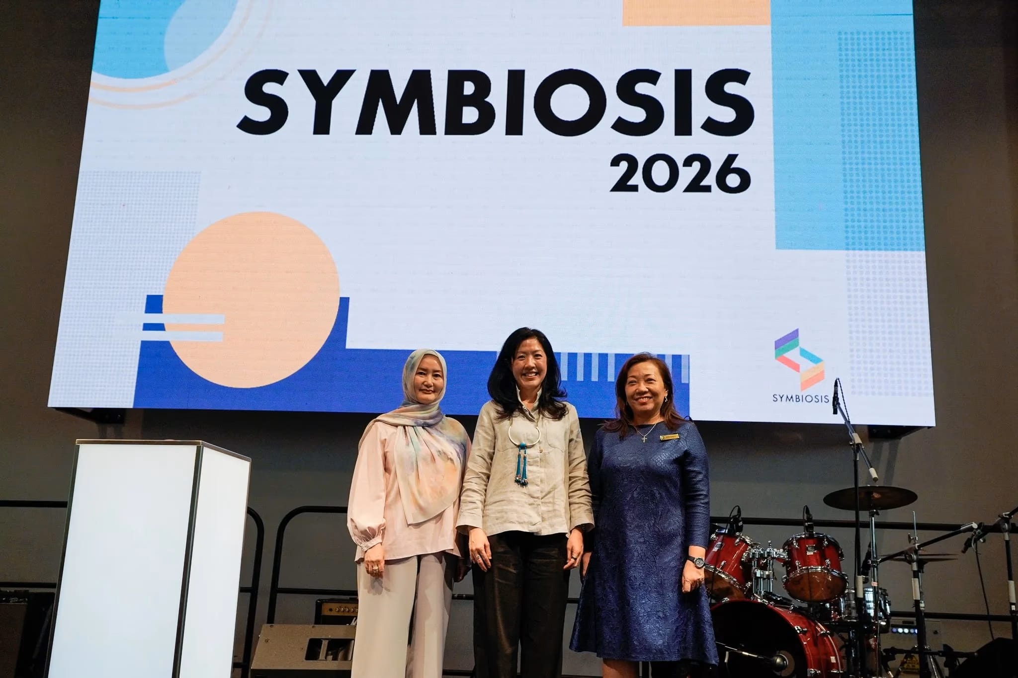 Ms Dawn Lim, Executive Director of DesignSingapore Council (centre), with Ms Emida Natalaray at the launch of SYMBIOSIS 2026, the STA graduation showcase at Republic Polytechnic.