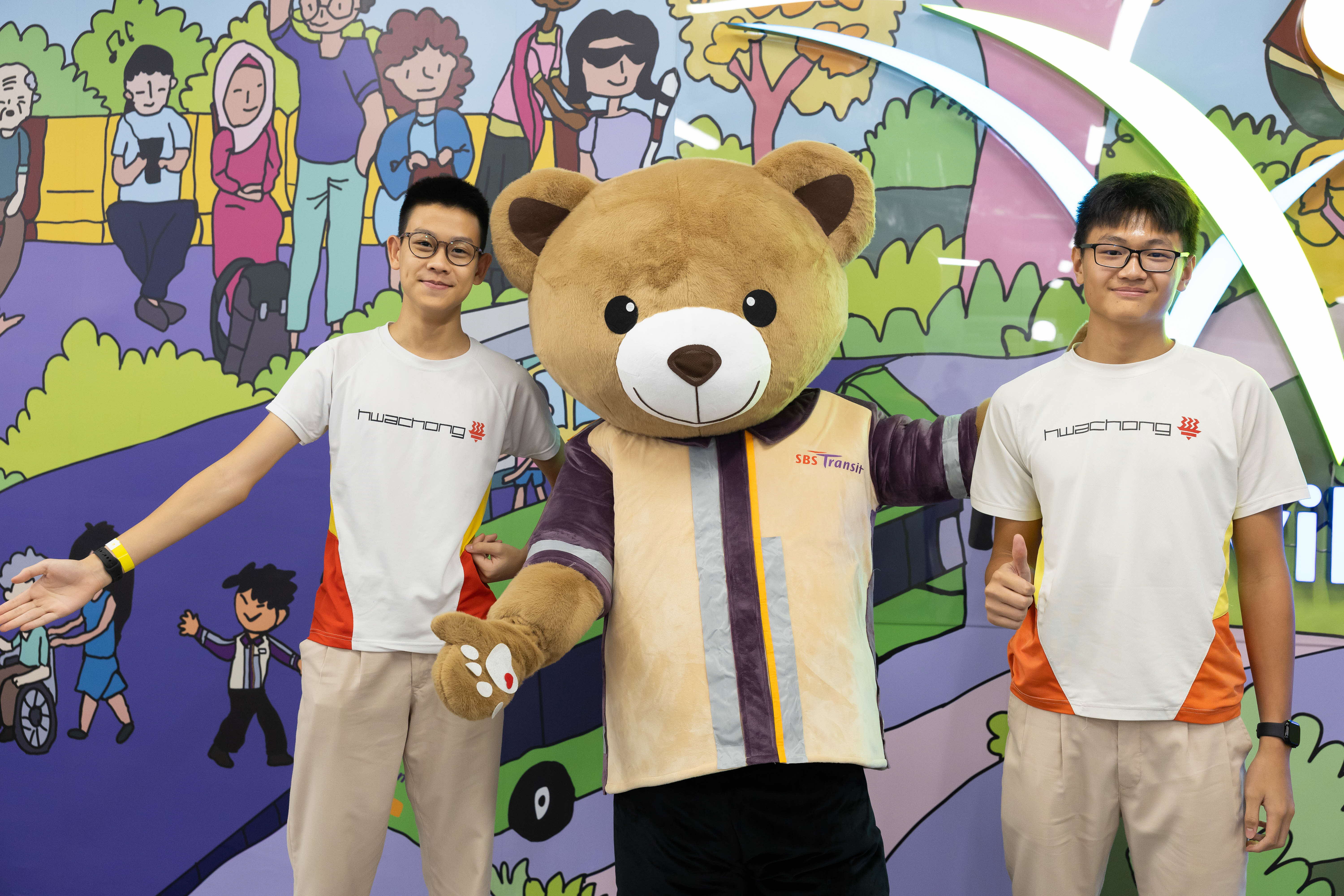 Image of students posing with the SBS mascot bear