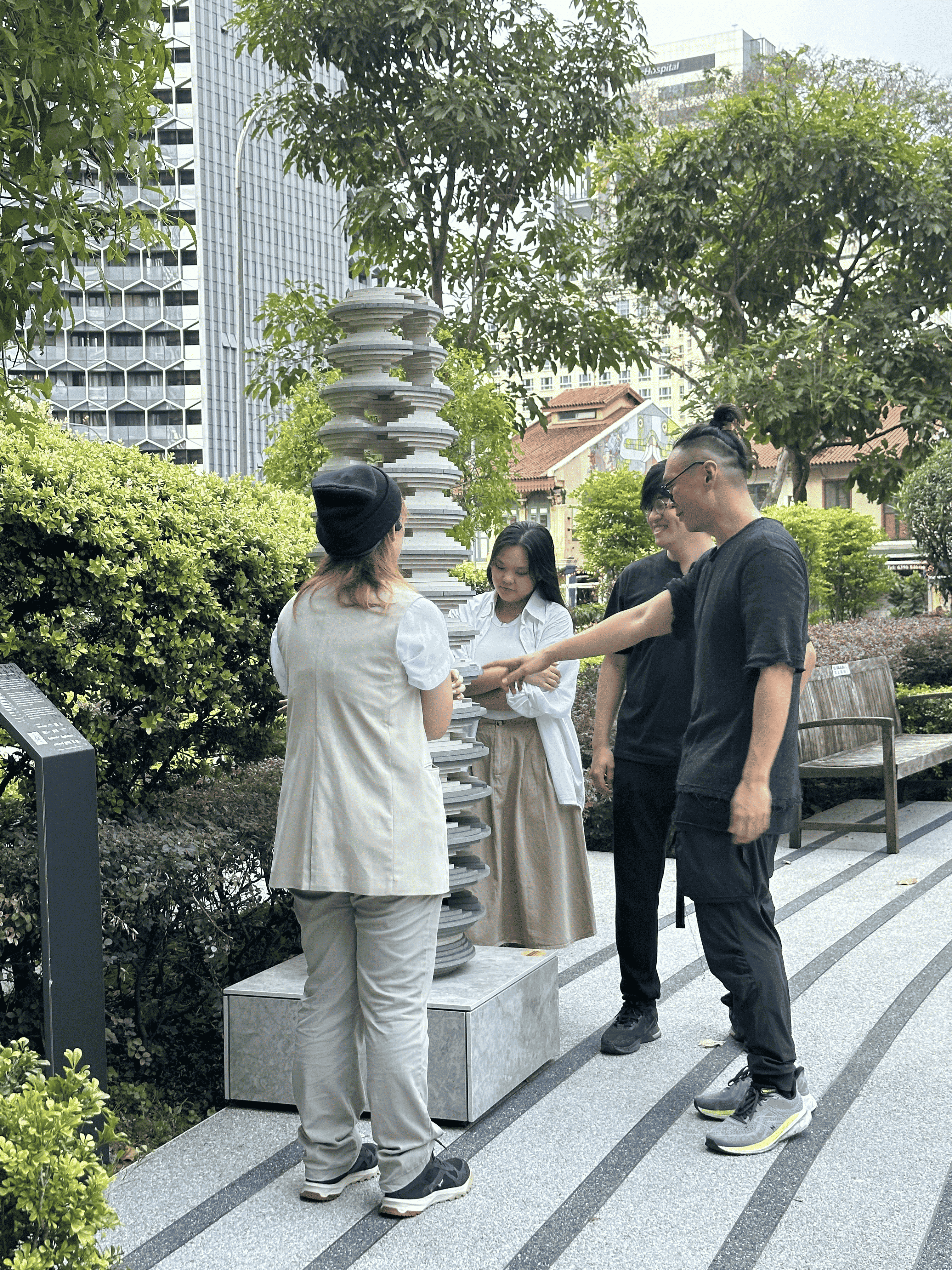 Eugene Kosgoron with fellow artists, admiring ‘Strata’ and its layers
