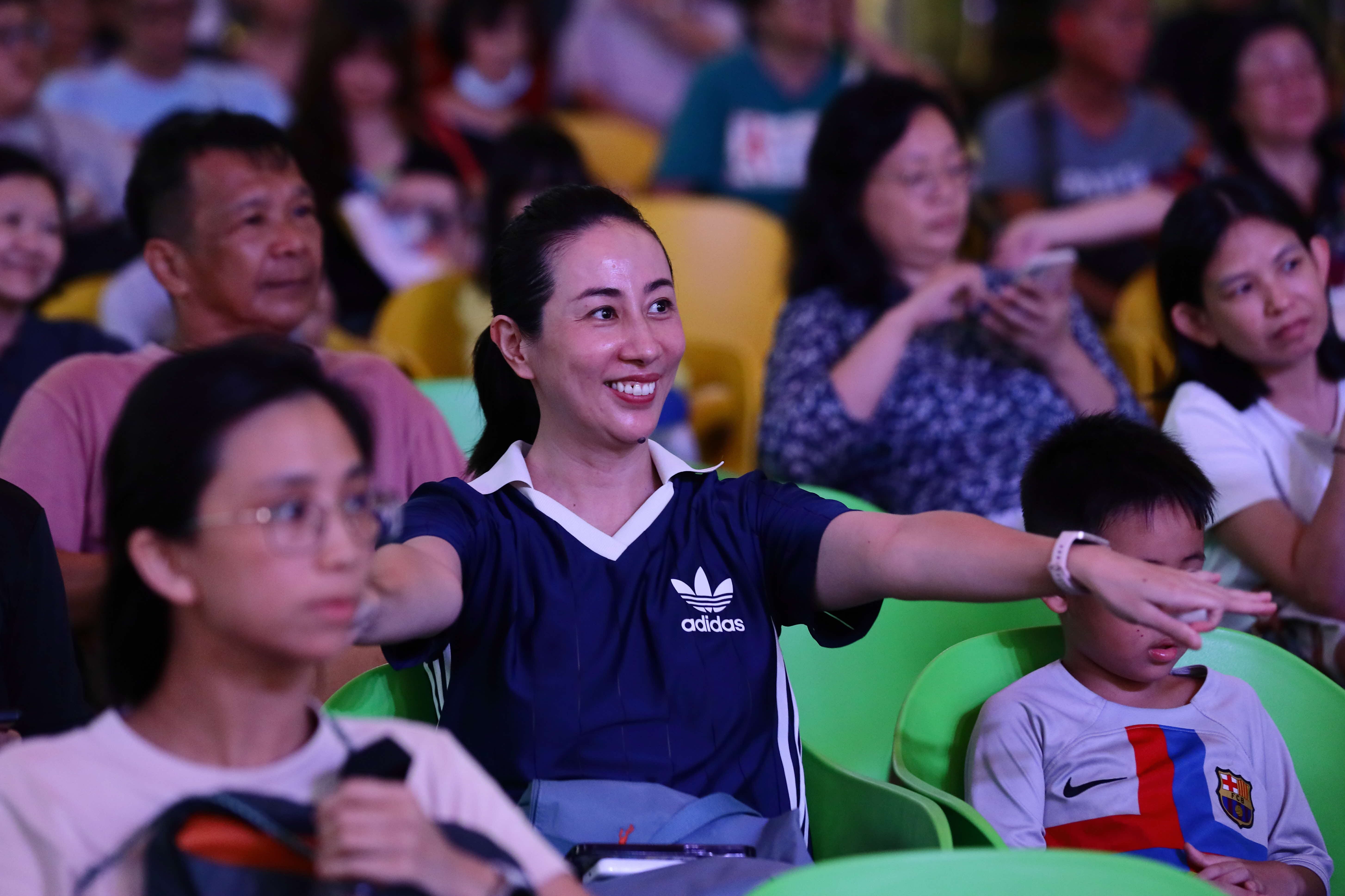An audience member enjoying herself at one of the ArtsEverywhere@CDC performances