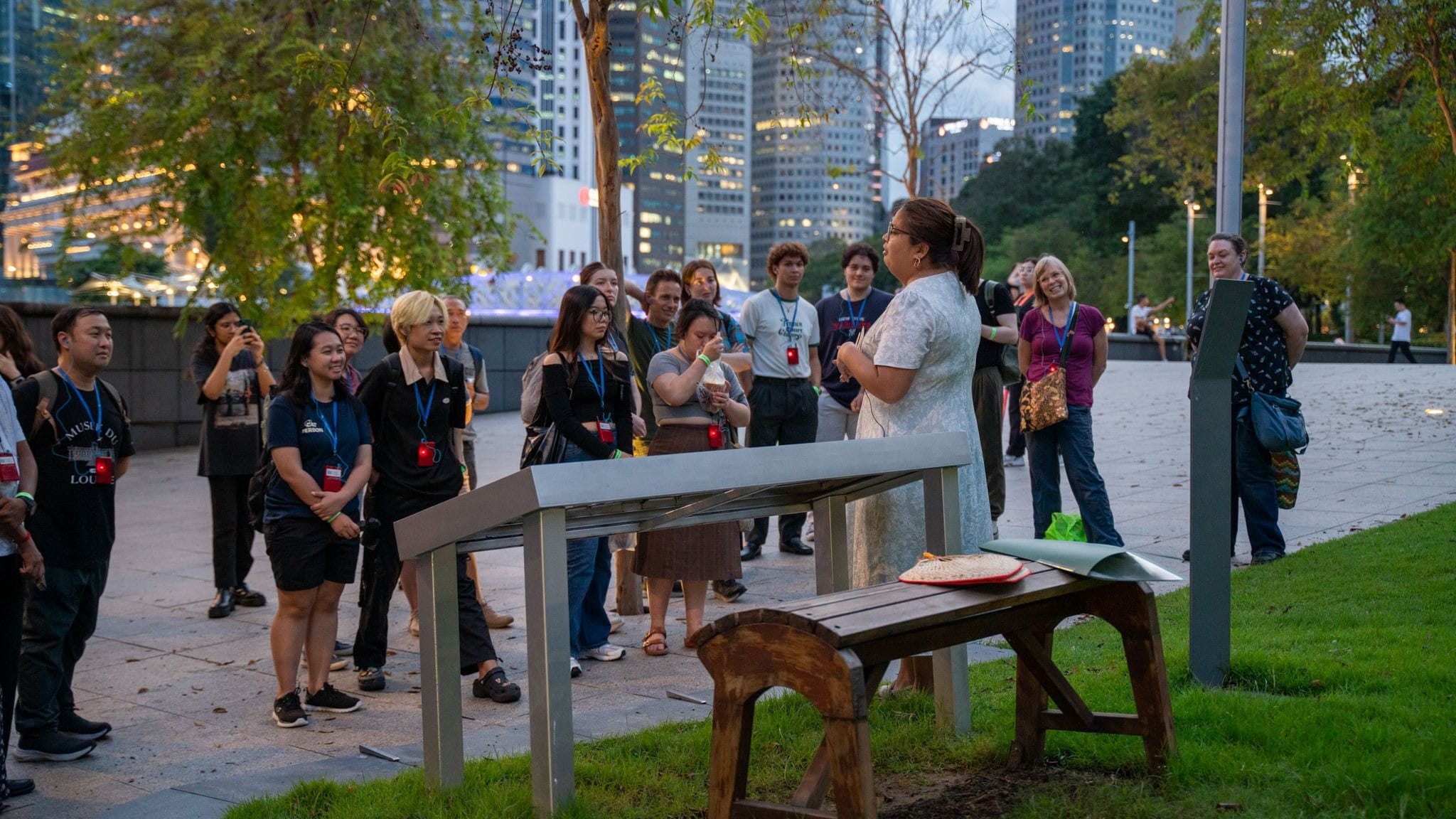 Attendees listening to a story on a walk in Singapore's CBD area.