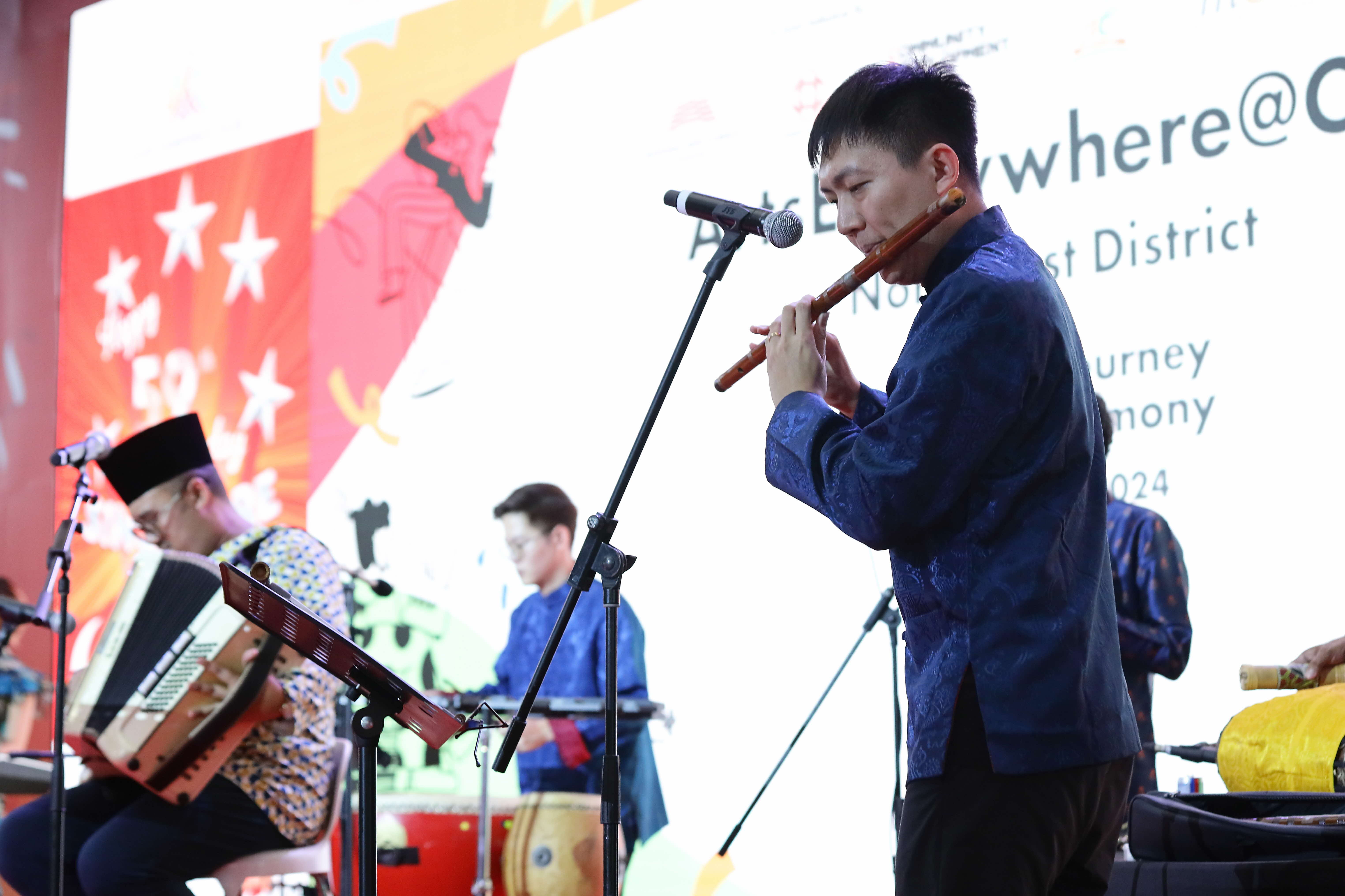 Tan Qing Lun playing the flute at an ArtsEverywhere@CDC performance
