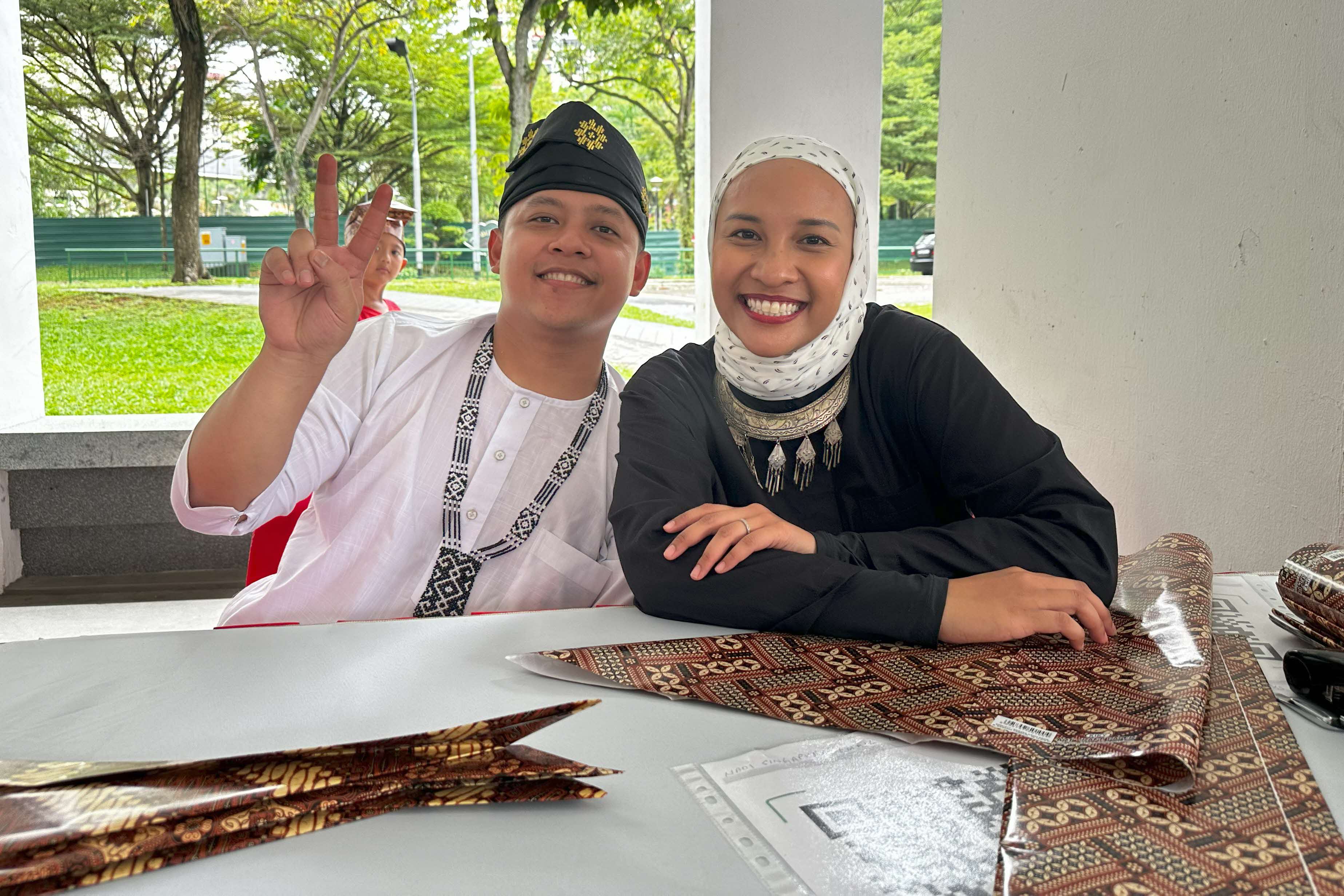 All smiles at the paper tanjak (Malay headgear) workshop led by NADI Singapura