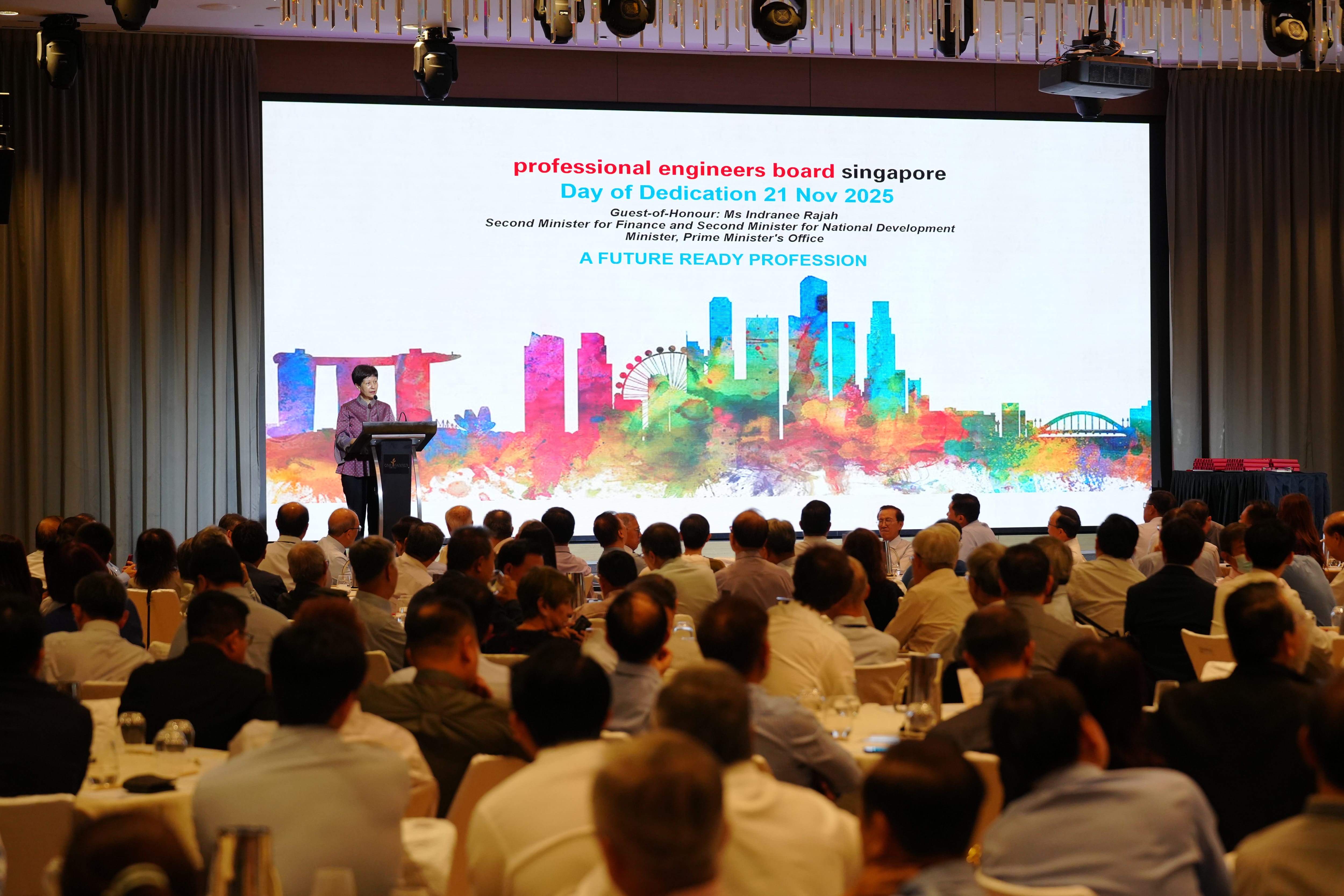 Guest-of-honour, Ms Indranee Rajah, addressing a large seated audience at the Professional Engineers Board Singapore Day of Dedication 2025.