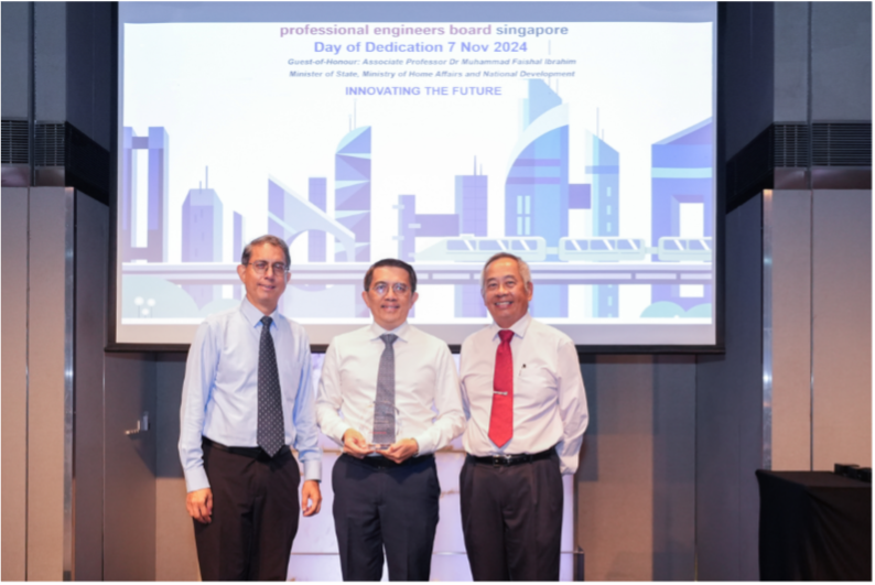 Three men in formal shirts and ties pose together at the Professional Engineers Board Singapore Day of Dedication, Nov 7 2024.