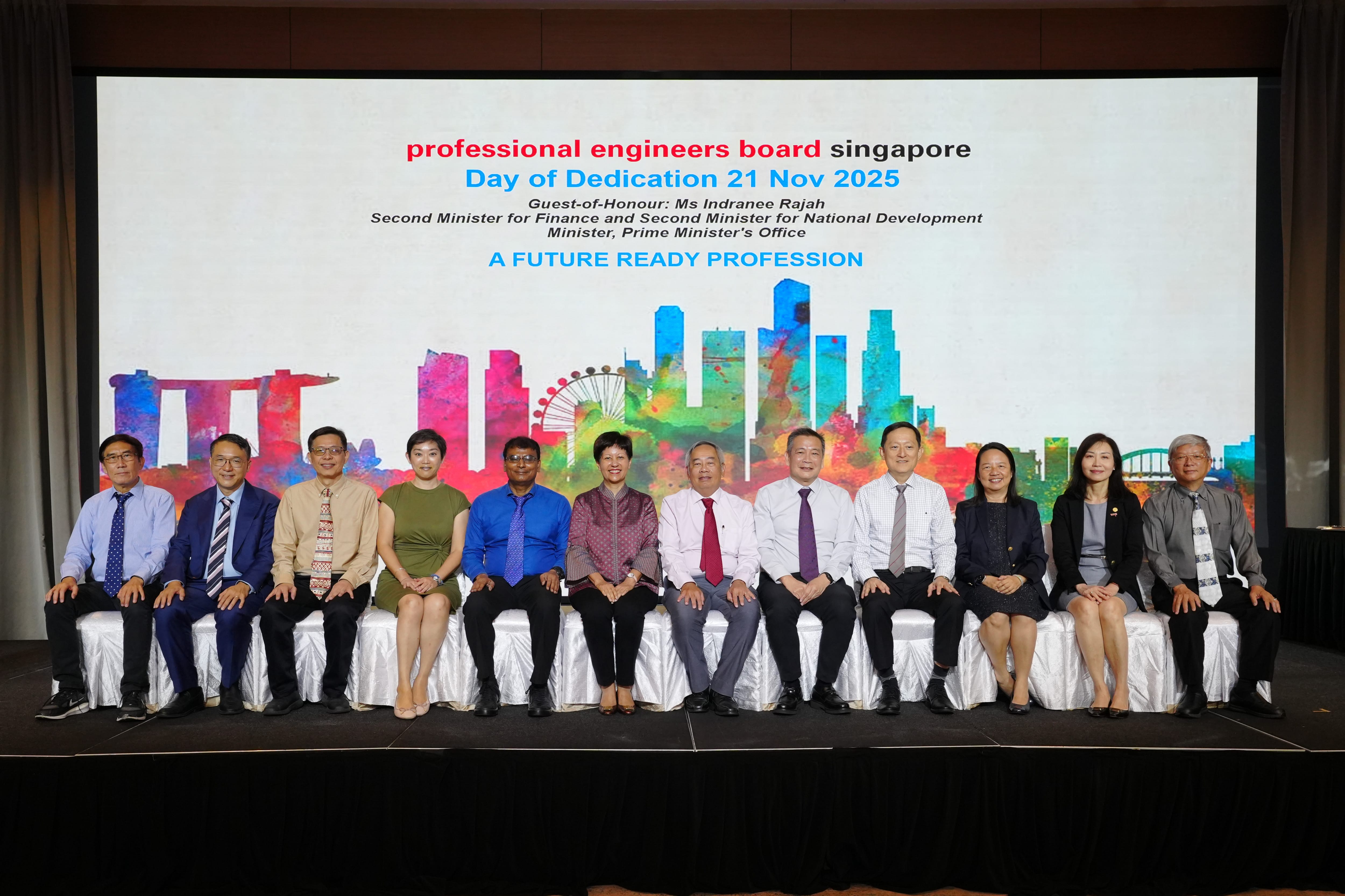 Twelve people seated in a row on stage at the Professional Engineers Board Singapore Day of Dedication, 21 Nov 2025.