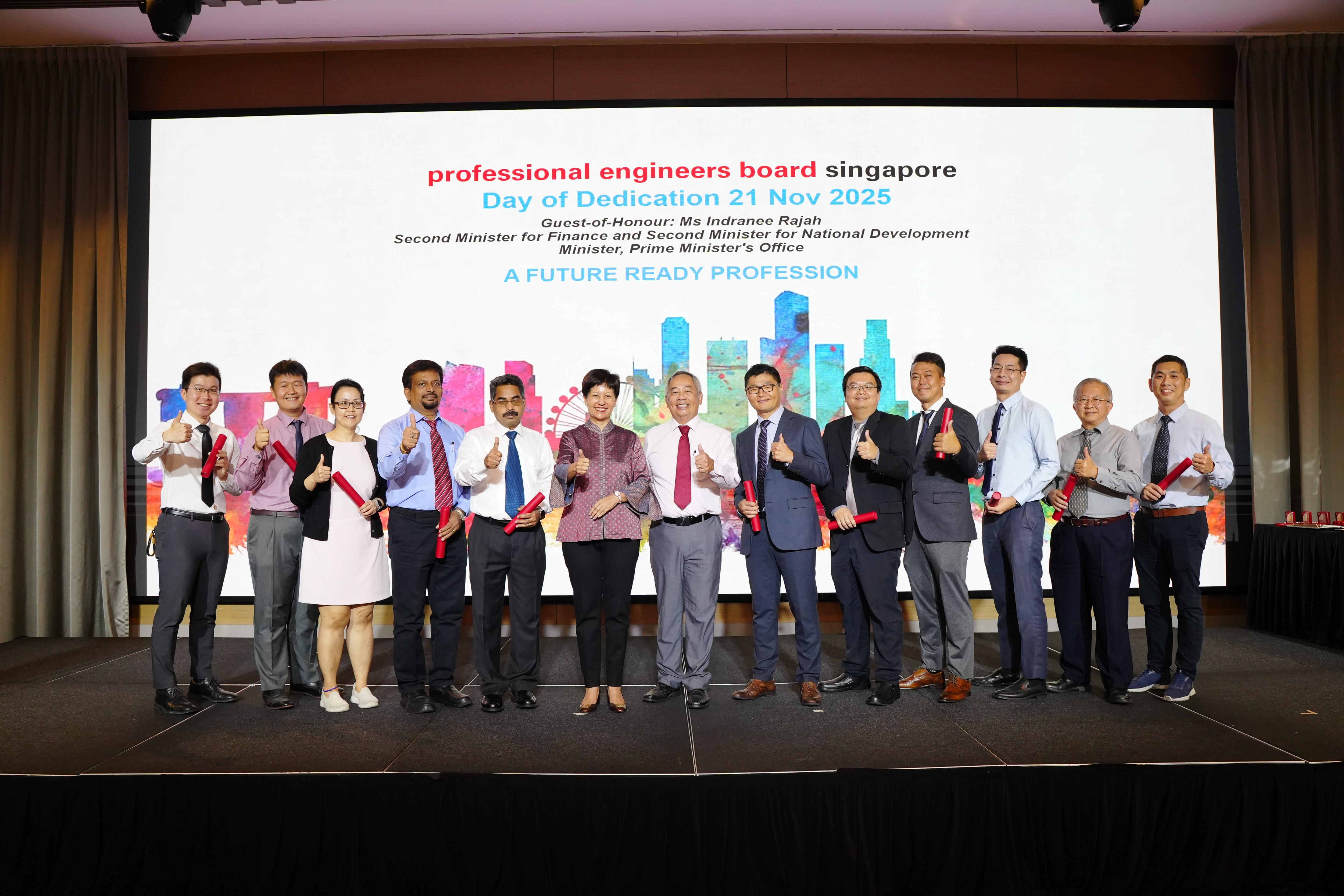 Group of professionals posing on stage at the Professional Engineers Board Singapore Day of Dedication, Nov 21 2025.