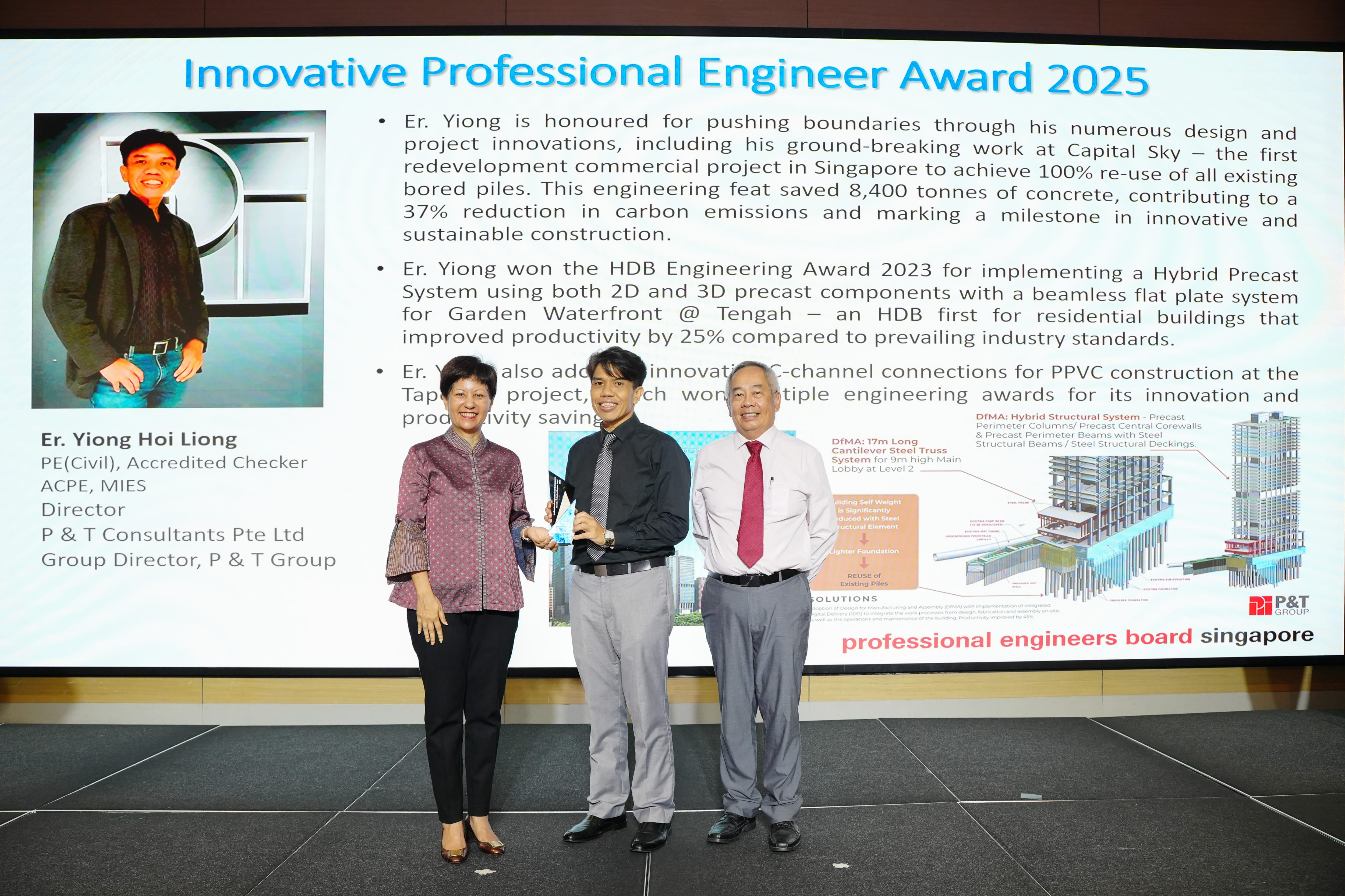 Three people stand on a stage in front of a slide reading Innovative Professional Engineer Award 2025 for Er. Yiong Hoi Liong.
