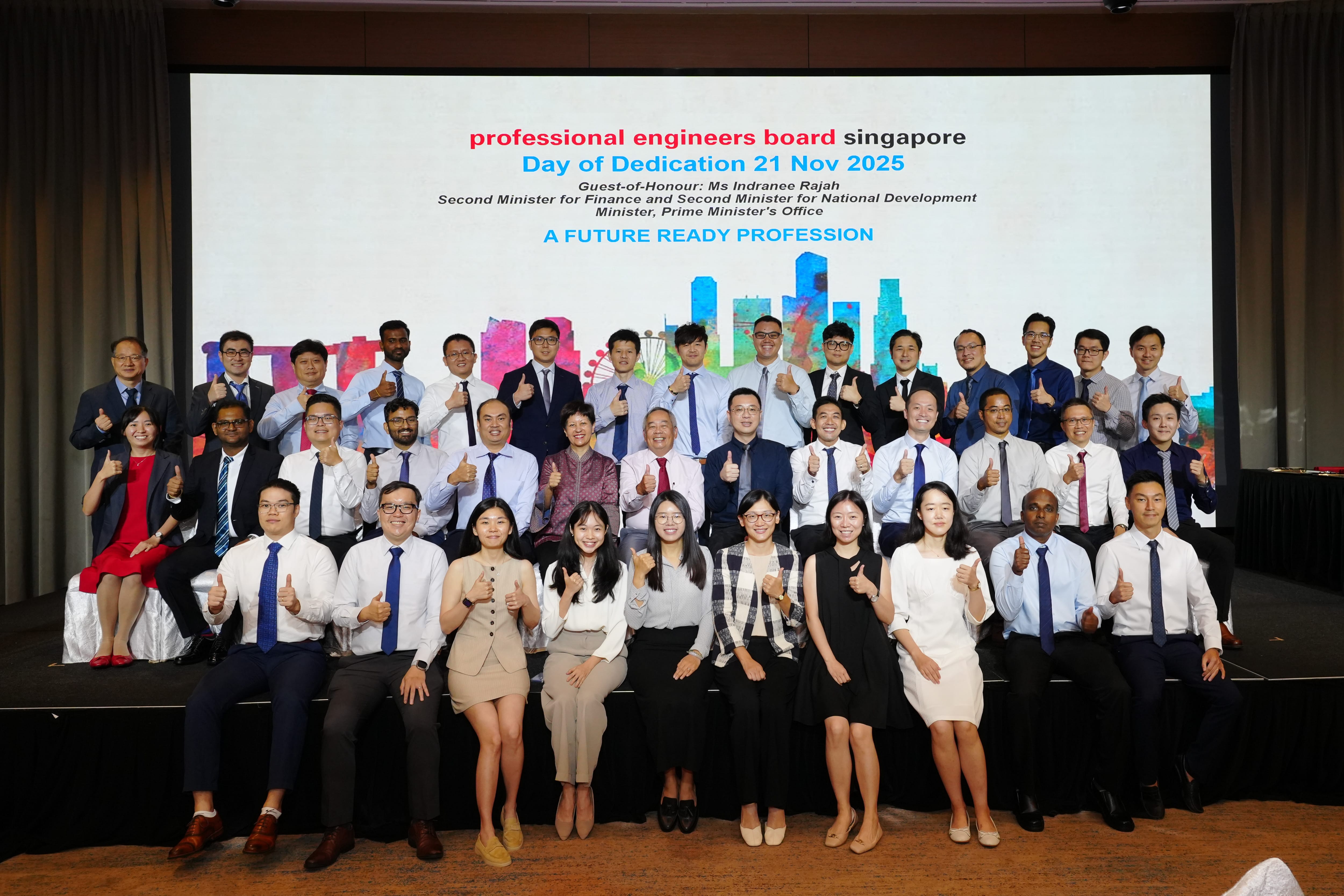 Group photo of professionals giving thumbs up at Professional Engineers Board Singapore Day of Dedication, 21 Nov 2025.