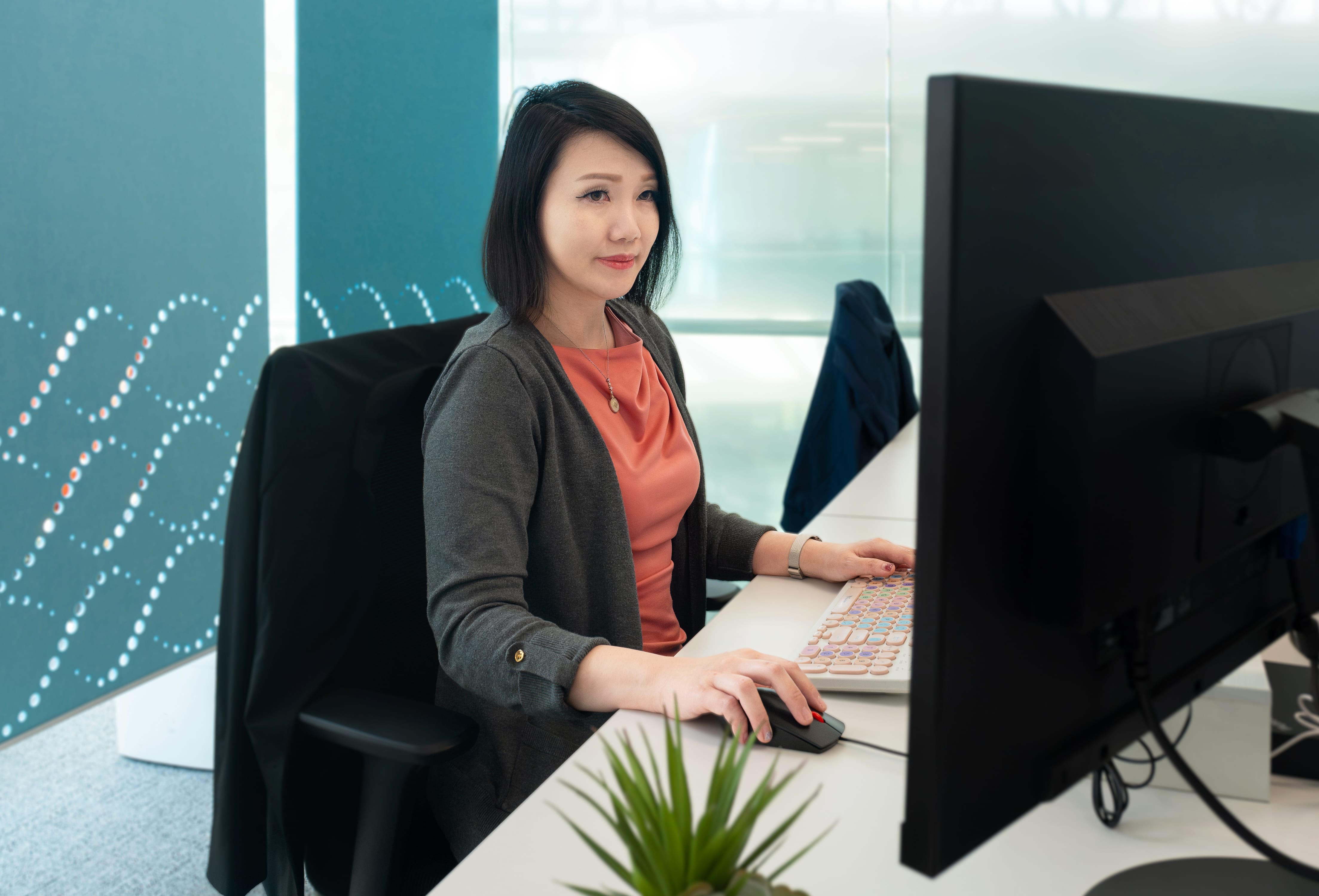 Lady with short hair browsing her computer