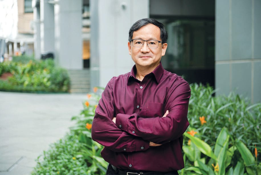 One man standing with hands folded