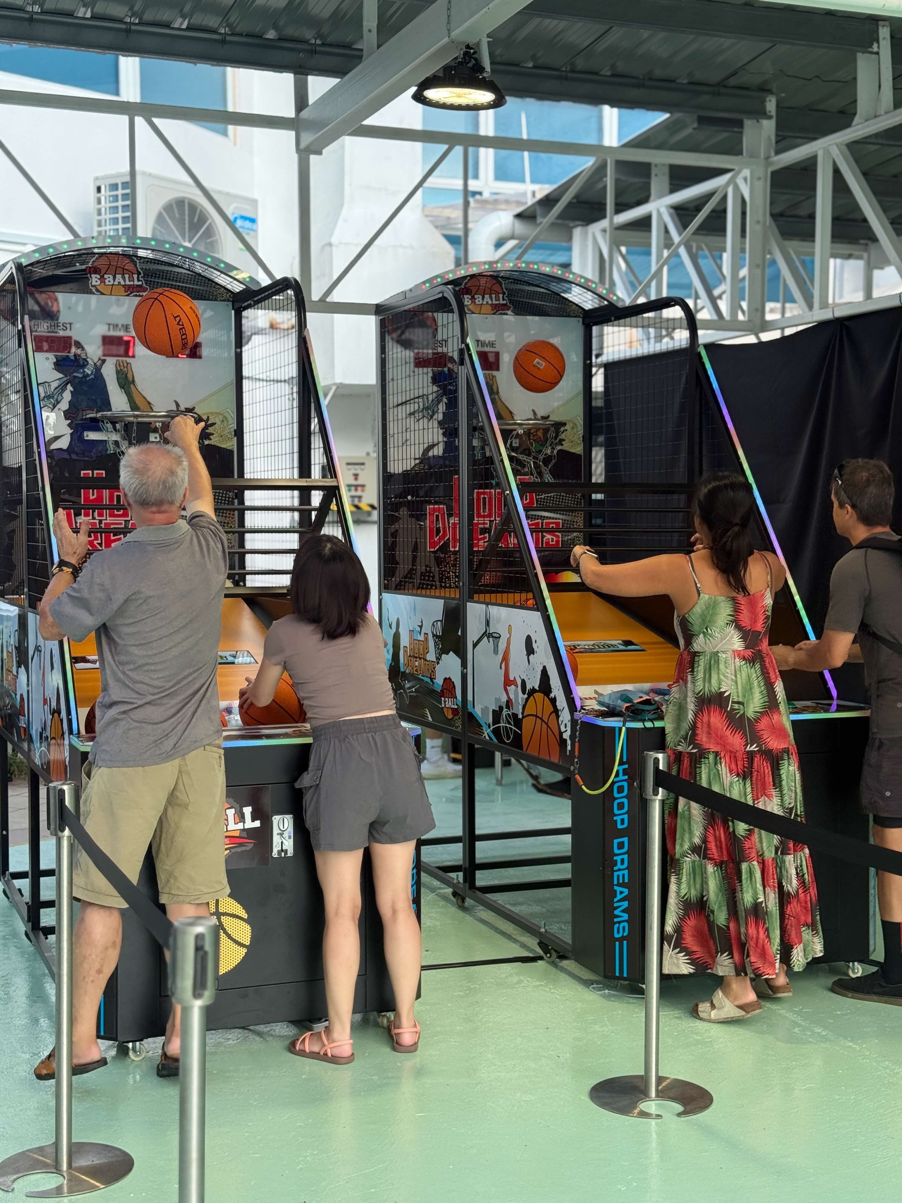 Resident plays basketball arcade game