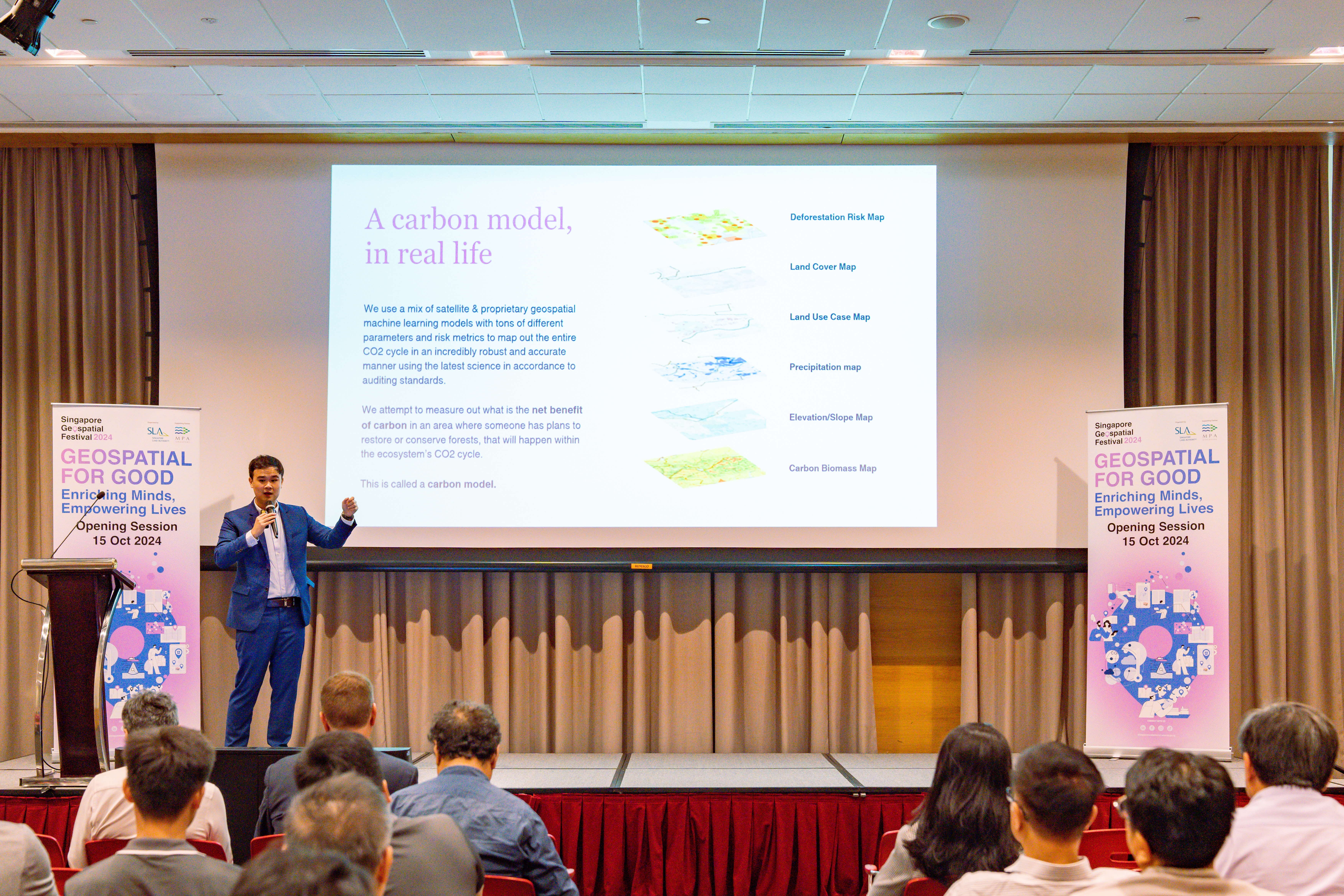 Mr Johann Wah, Co-Founder of Nika.eco presents carbon model slides on stage.