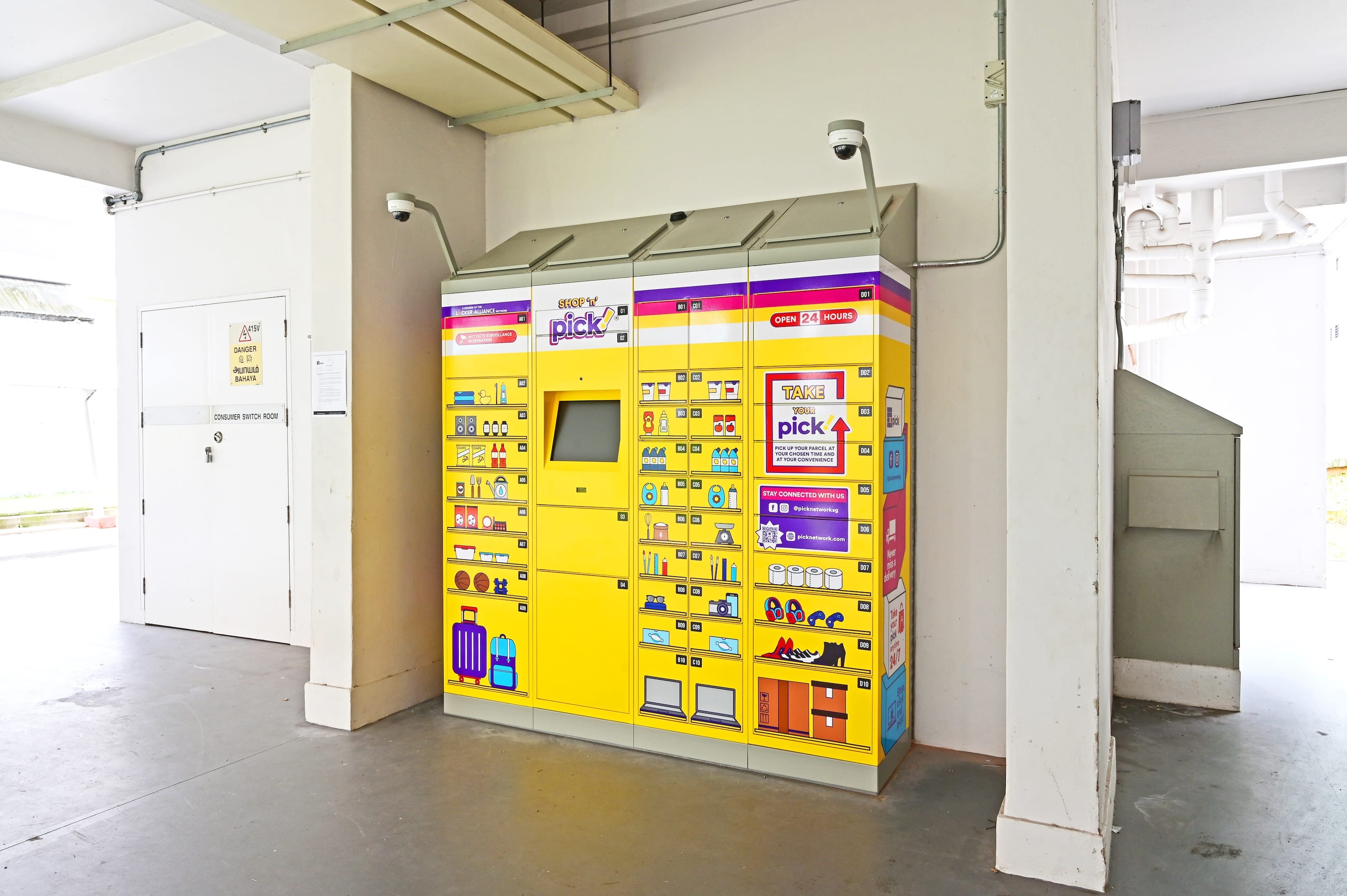 Bright yellow parcel locker installed in a sheltered public area.