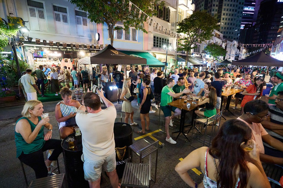 People patronising restaurants along Boat Quay at night
