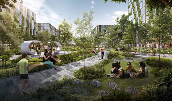 Park scene with people relaxing, walking, and playing. Buildings with green walls are visible in the background. Fountains, trees, and paths are in the park.