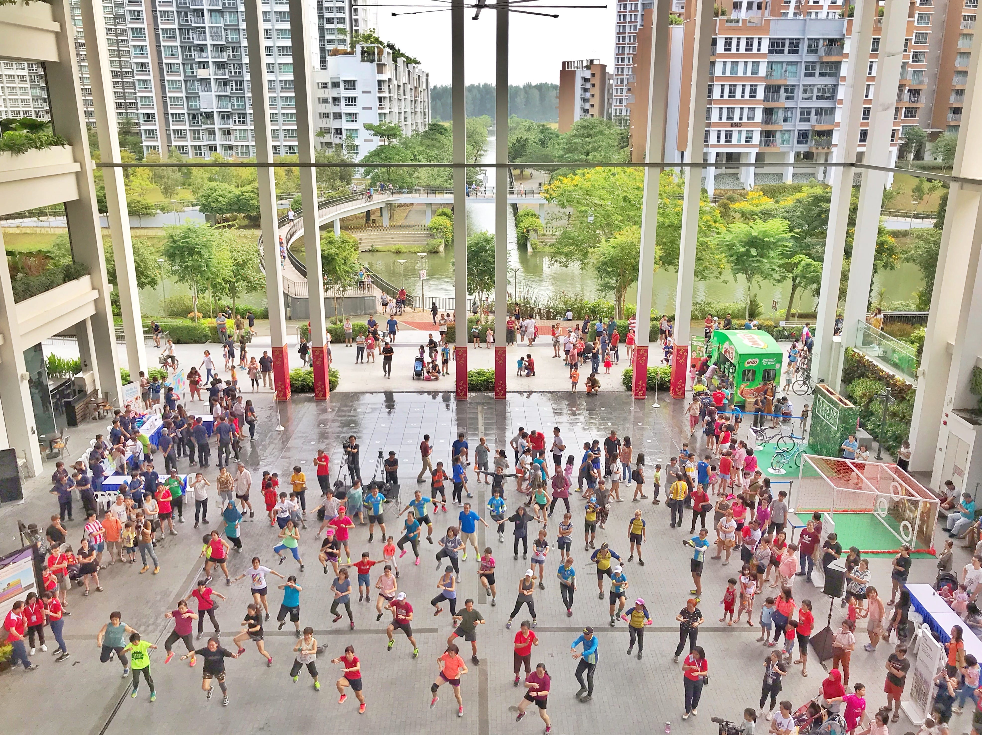 Photo of people exercising at atrium of Oasis Terraces