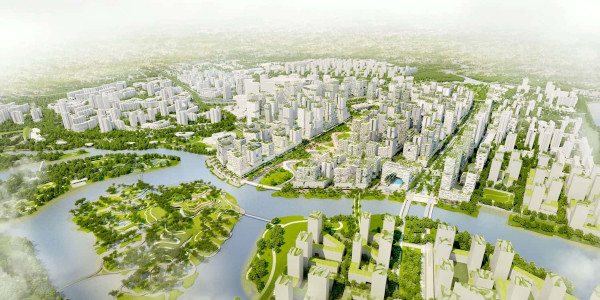 Aerial view of a city with modern buildings, green spaces, and a river running through it.