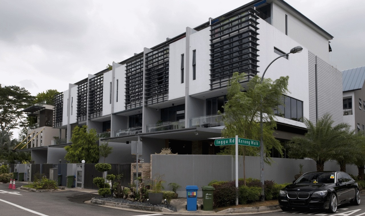 Modern private terrace houses along street with cars and landscaped frontage.