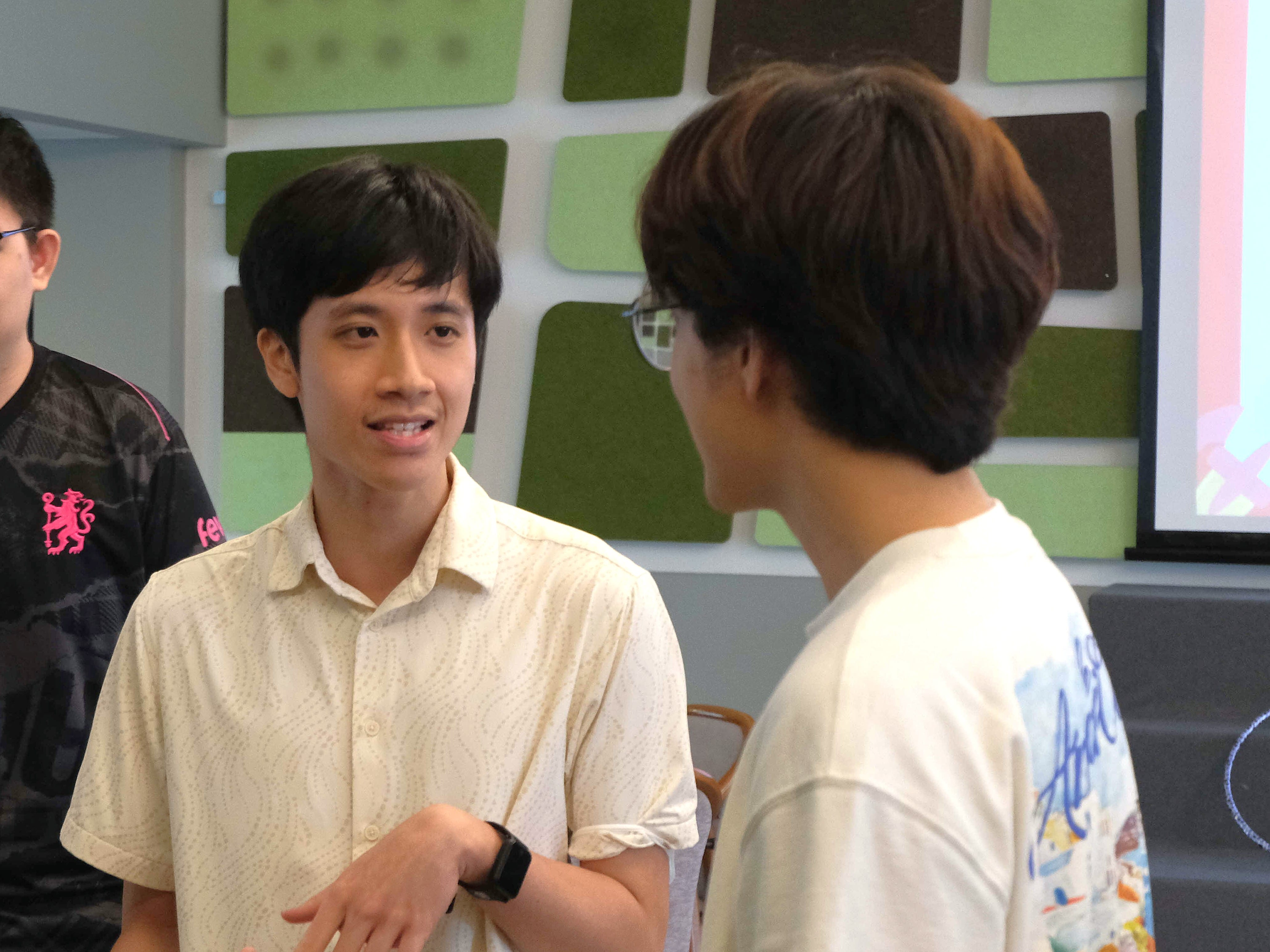 Image of two interns smiling at the camera