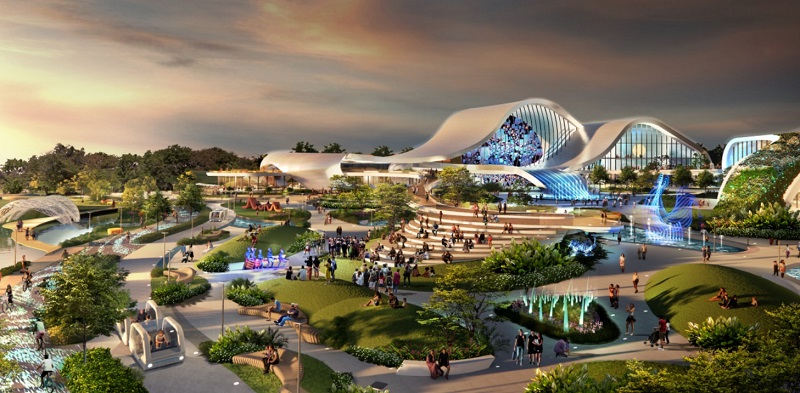 Rendering of a modern park with futuristic buildings, fountains, greenery, and people enjoying the space.