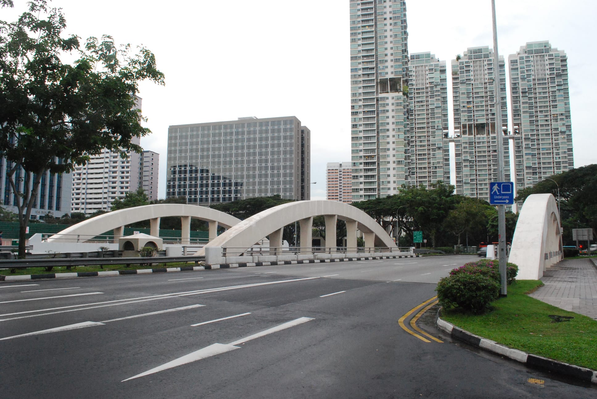 Crawford Bridge with white arches and high-rise buildings in the background