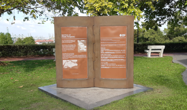 Information board about the Battle at Pasir Panjang in a park setting.