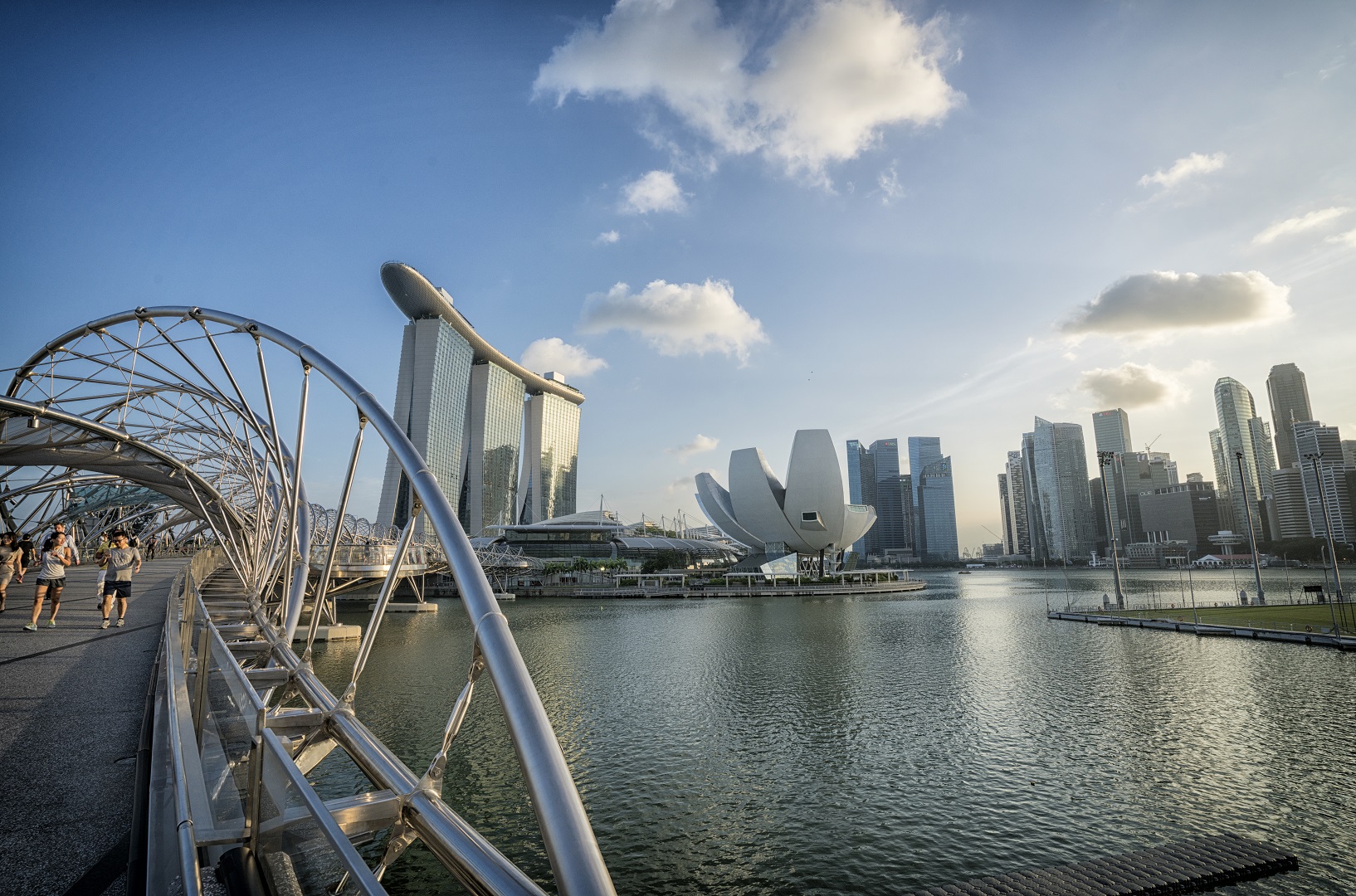 Singapore cityscape: Helix Bridge, Marina Bay Sands, ArtScience Museum, and skyscrapers.