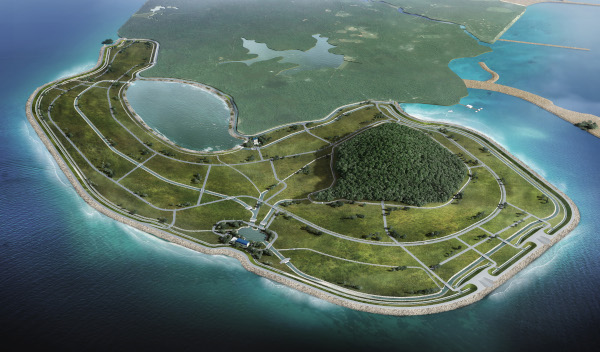 Aerial view of a planned island community with roads, trees, and houses surrounded by the ocean.