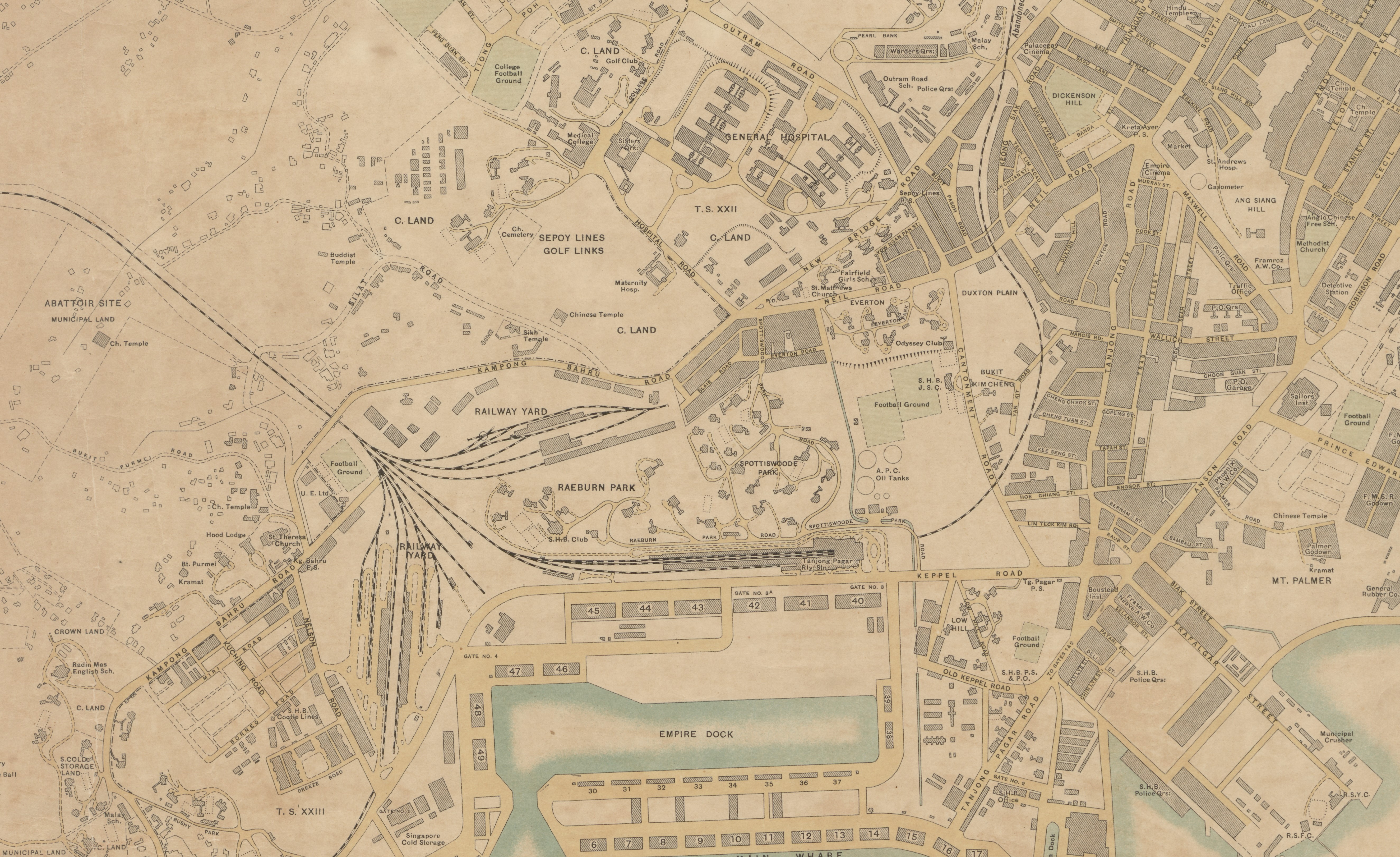Detailed vintage map of Singapore featuring docks, railway, and street layout with labeled landmarks and buildings.
