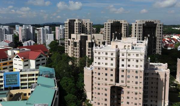 Aerial view of mixed residential estates with high-rise apartments and surrounding neighbourhood buildings.
