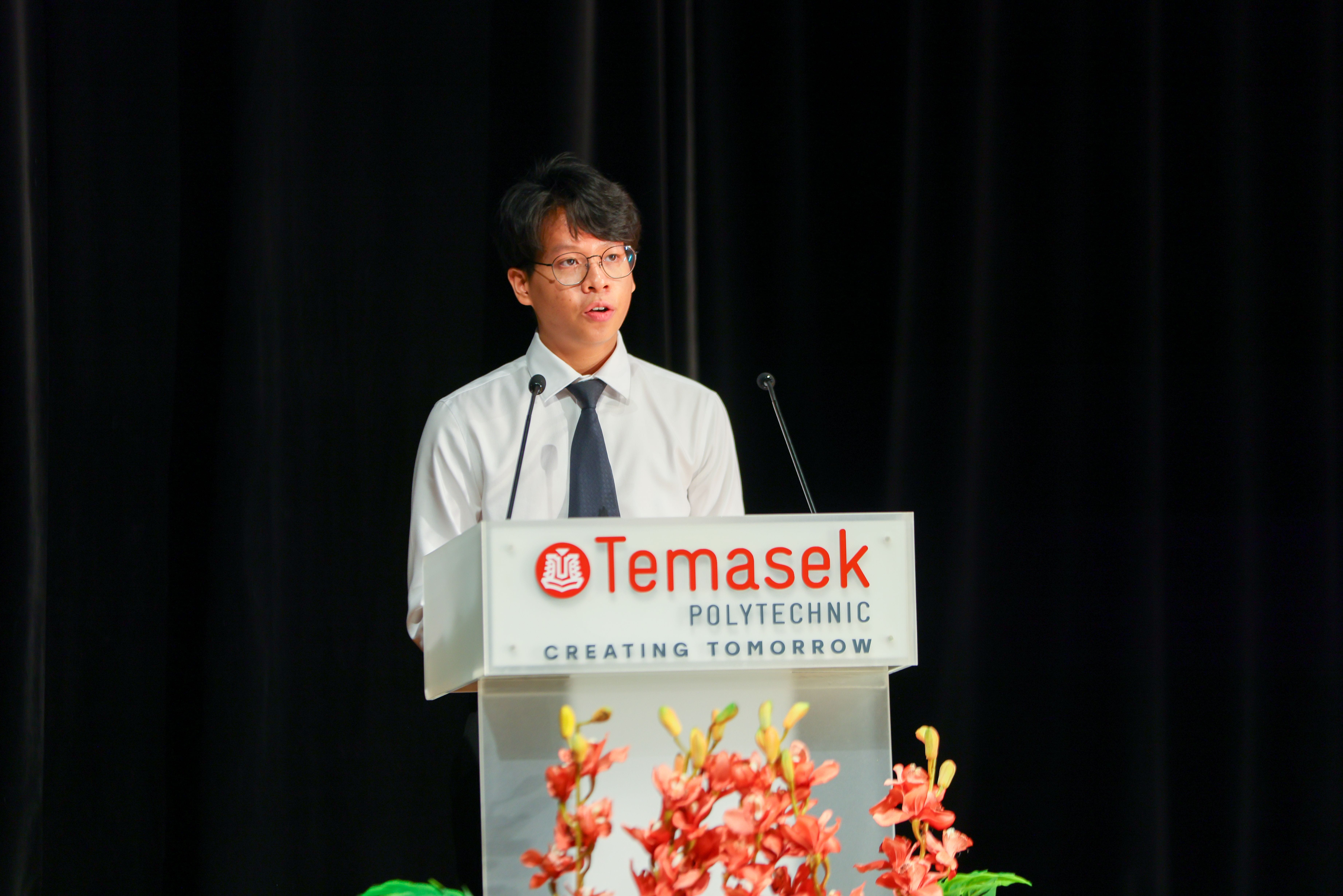 Image of a student speaker addressing the audience at the TP Scholarships Presentation