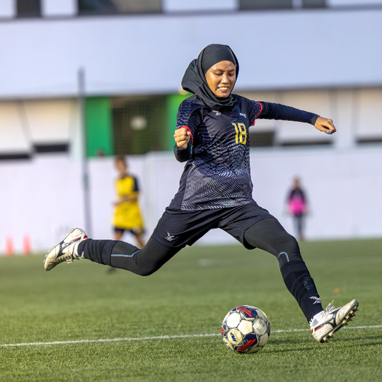 Image of Soccer players engaging in the sport